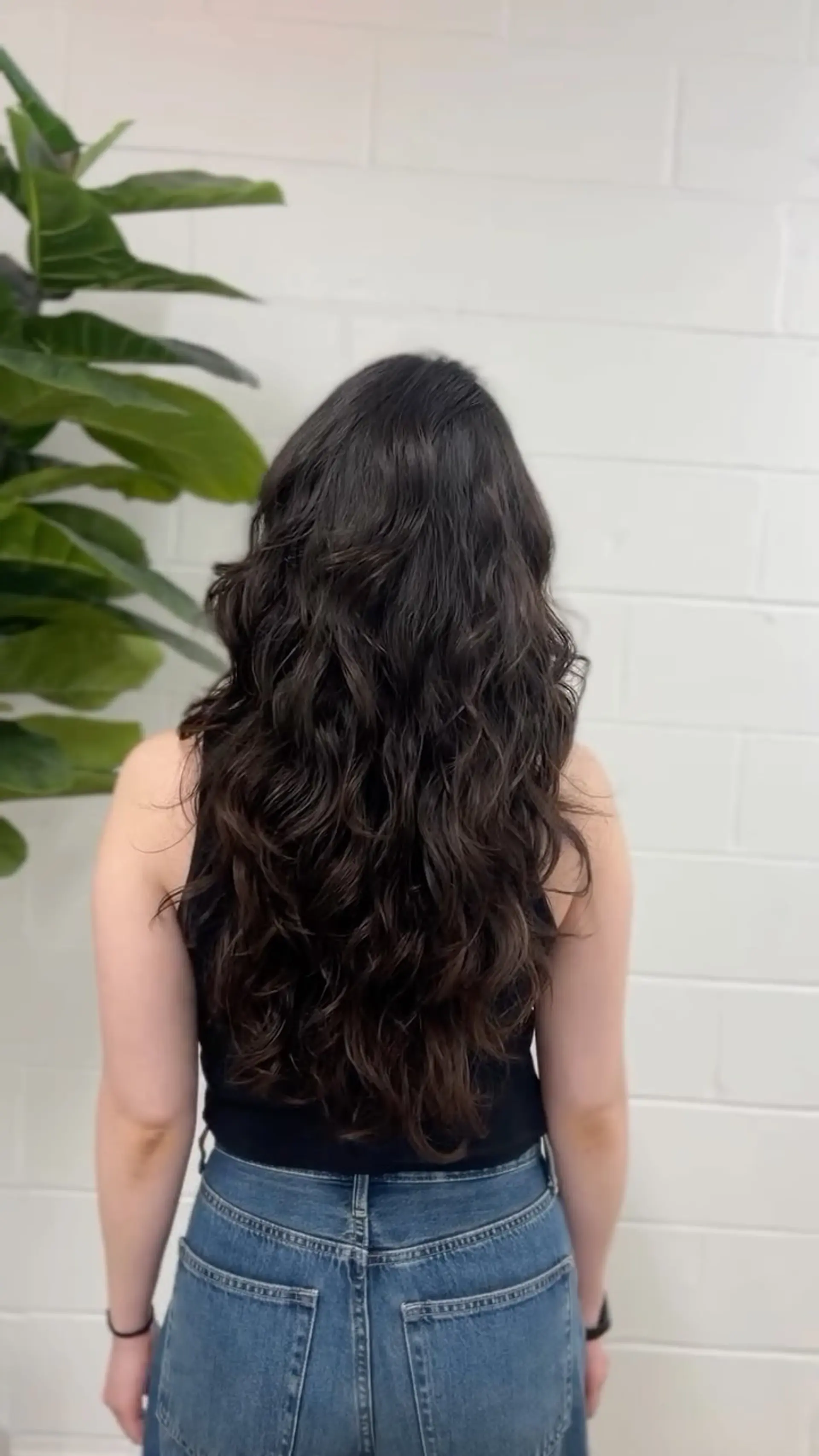 Long, thick dark hair with textured layers styled in cascading, voluminous digital perm waves. 1