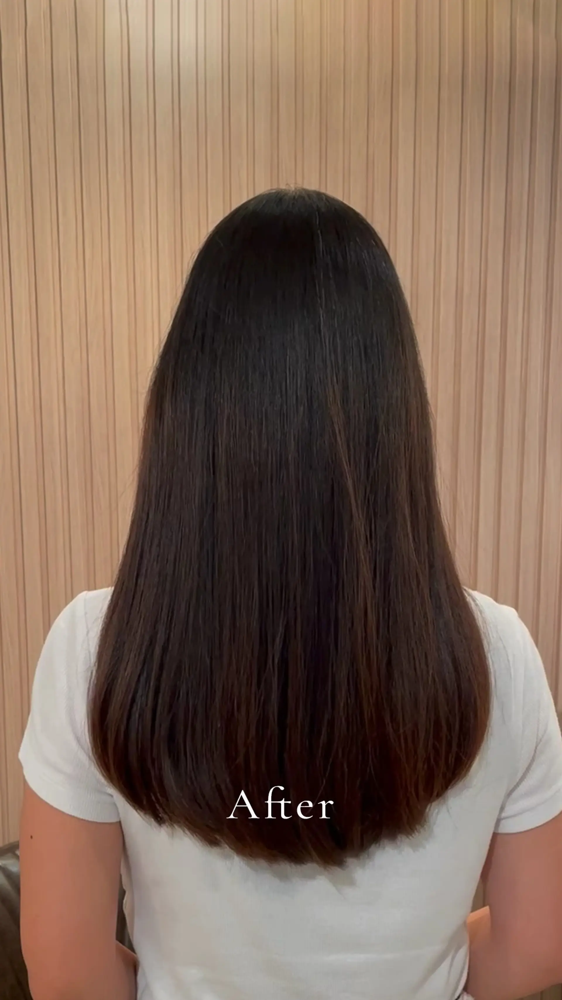 Sleek and glossy long dark hair straightened smooth with subtle soft ends. 1
