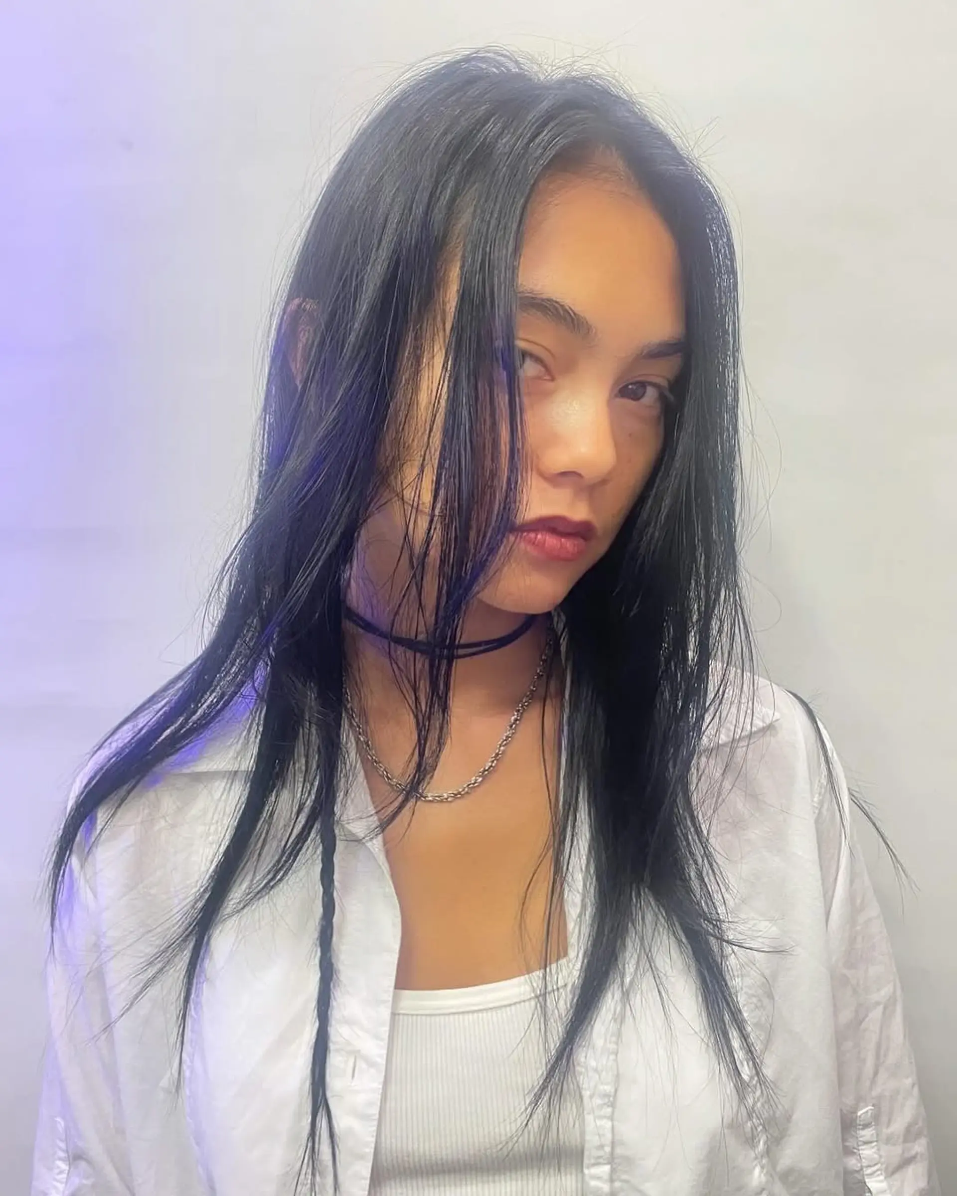 A long, straight cut with soft, textured layers and a lived-in, piecey finish that frames the face. 1