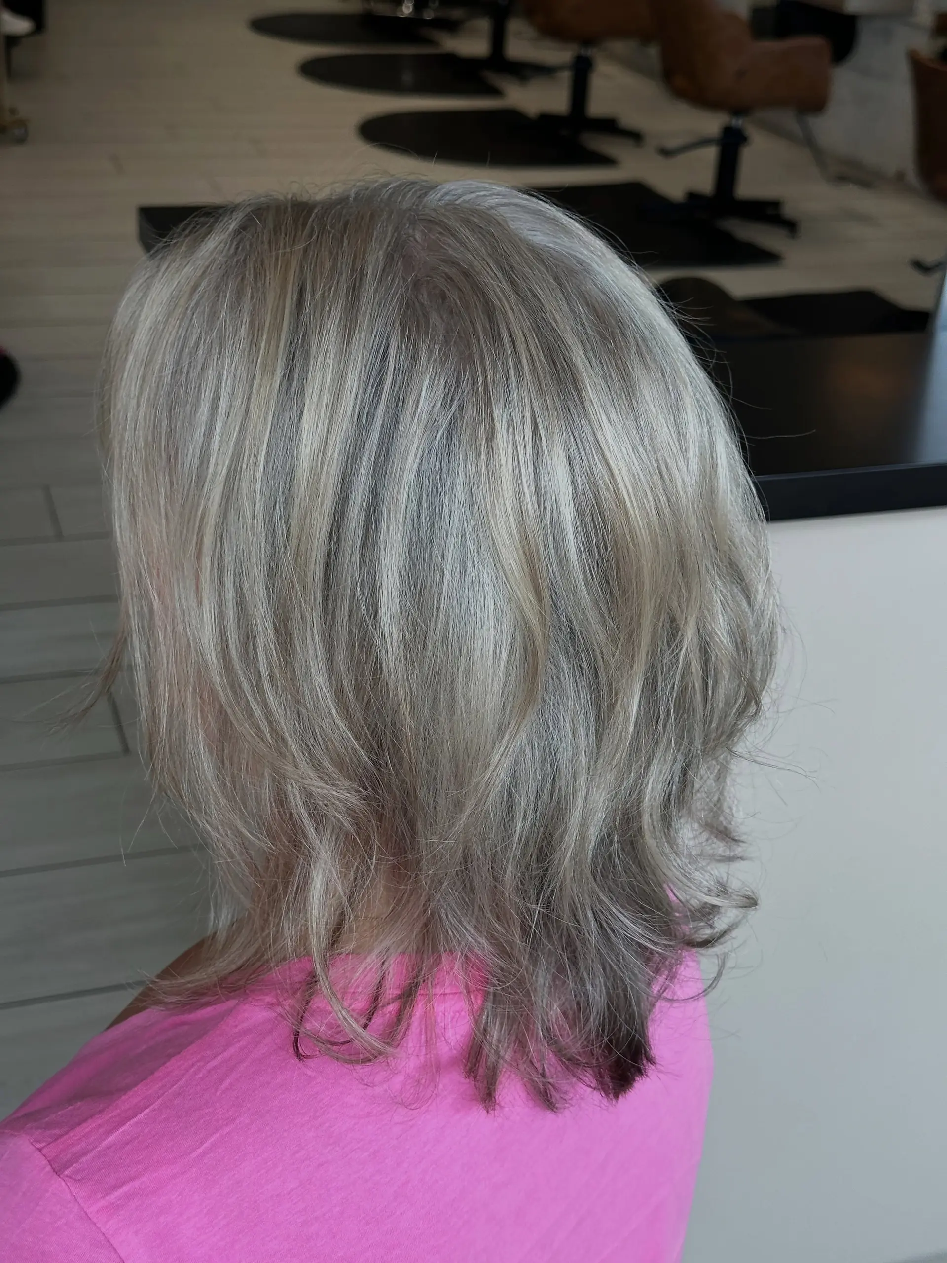 Medium-length textured cut featuring grey blending foil highlights in cool silver tones. 1