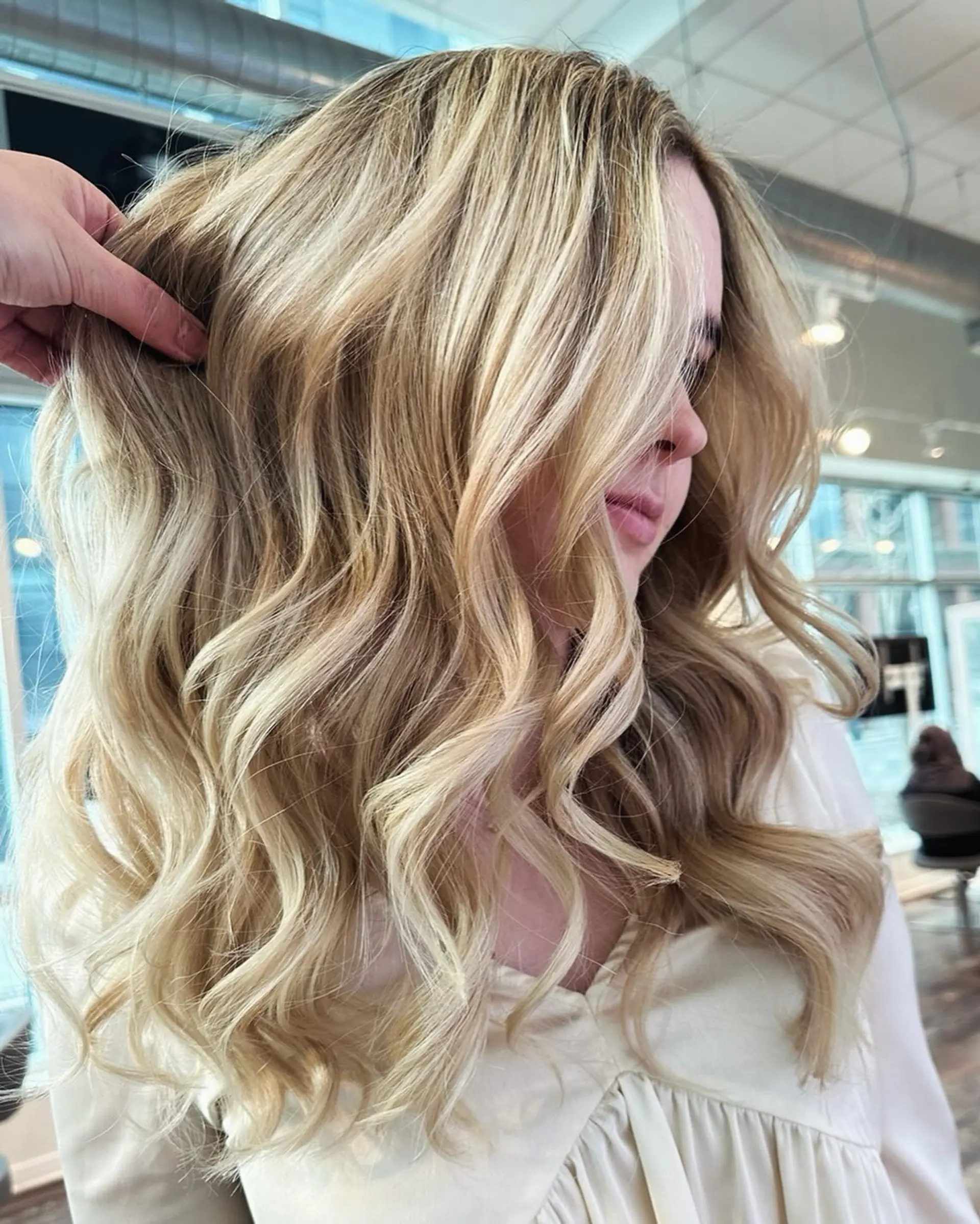 Long, soft beachy waves with a dimensional blonde balayage. 1
