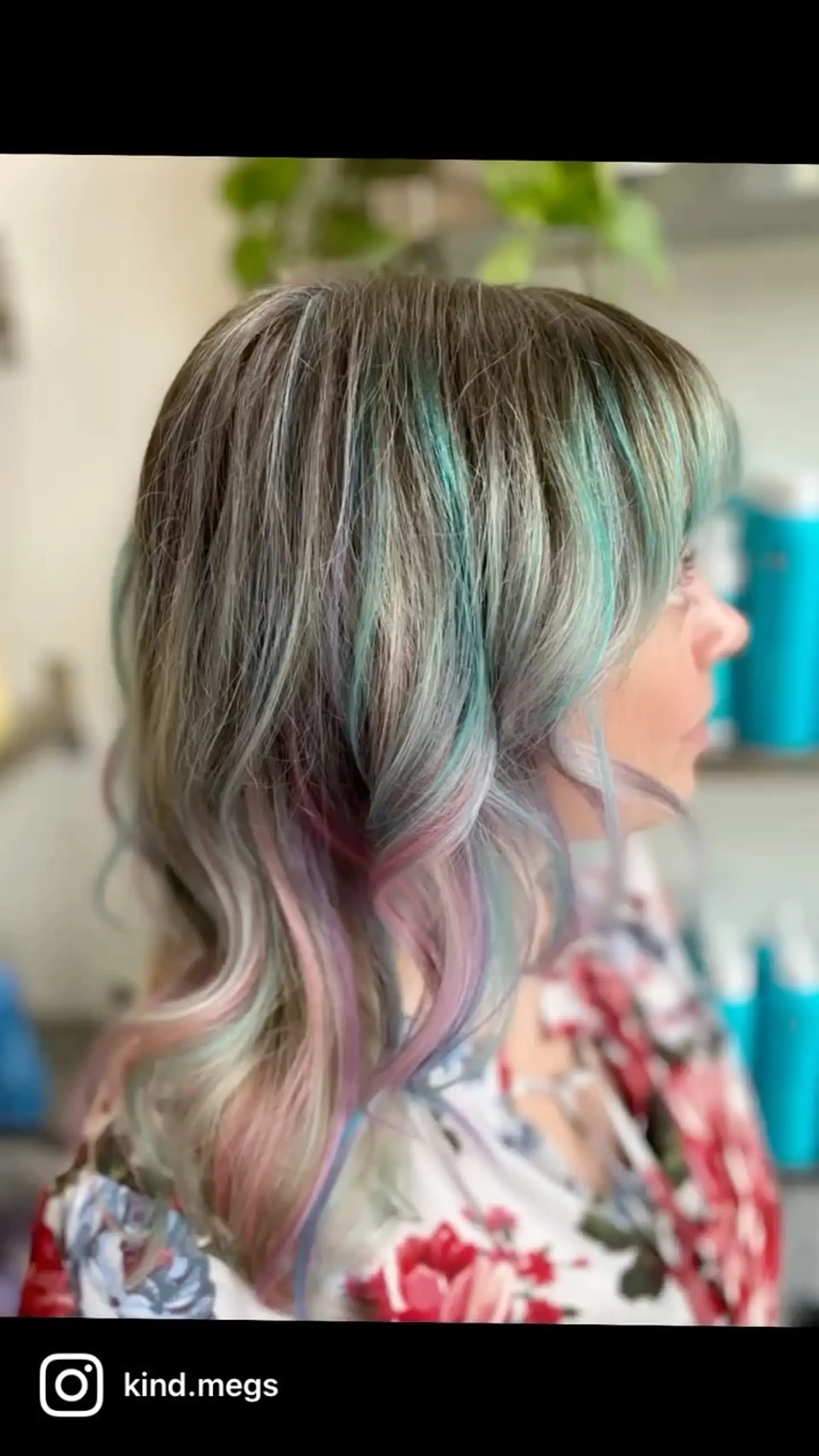 Medium-length ash blonde hair styled with full fringe bangs and soft waves, enhanced with colorful pastel teal, pink, and lavender highlights throughout. 1
