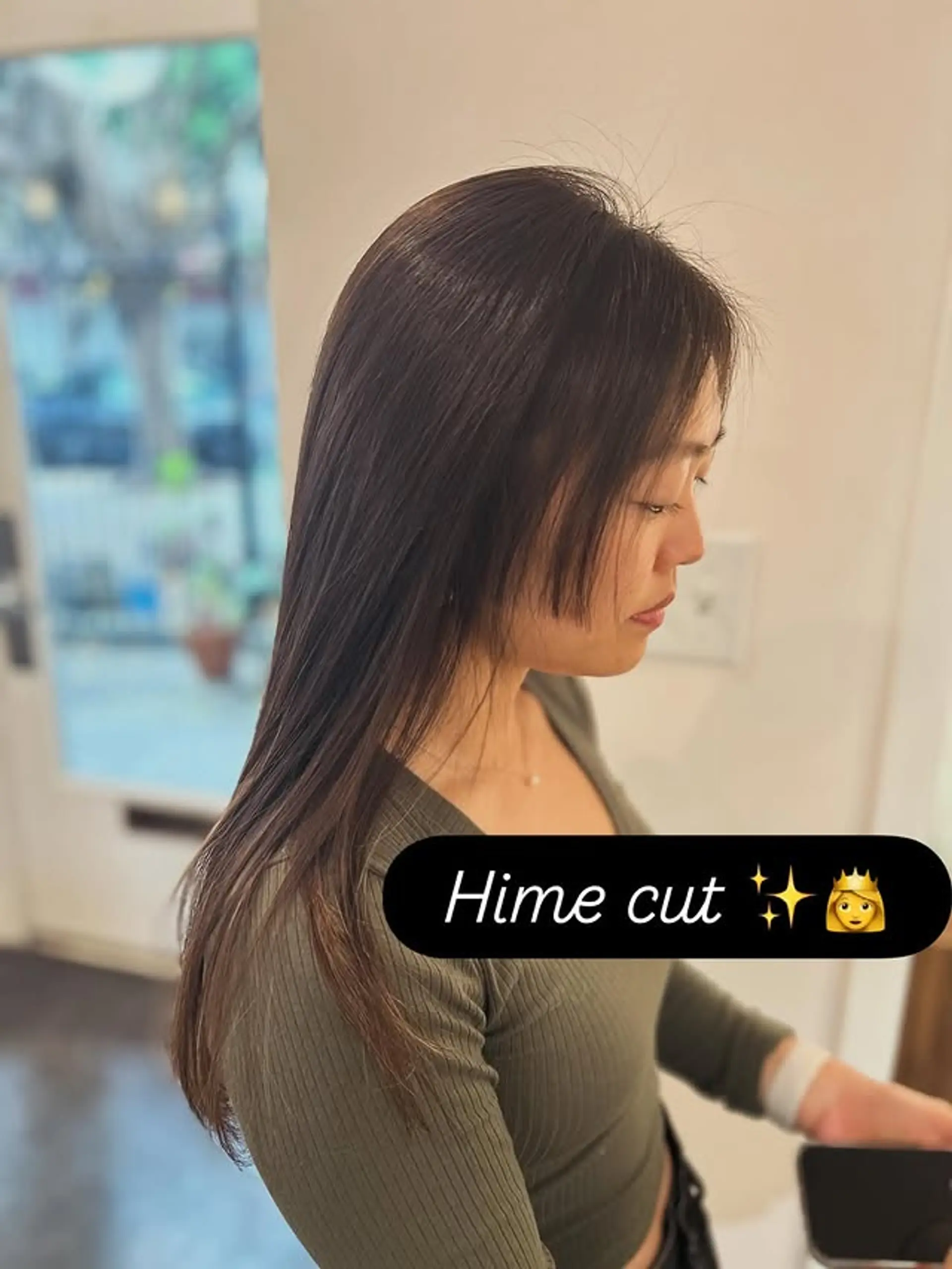 The Hime cut is a striking Japanese hairstyle defined by blunt, cheek-length side sections and long, straight hair. This rendition emphasizes a sleek finish and clean lines, creating a dramatic frame for the face. 1