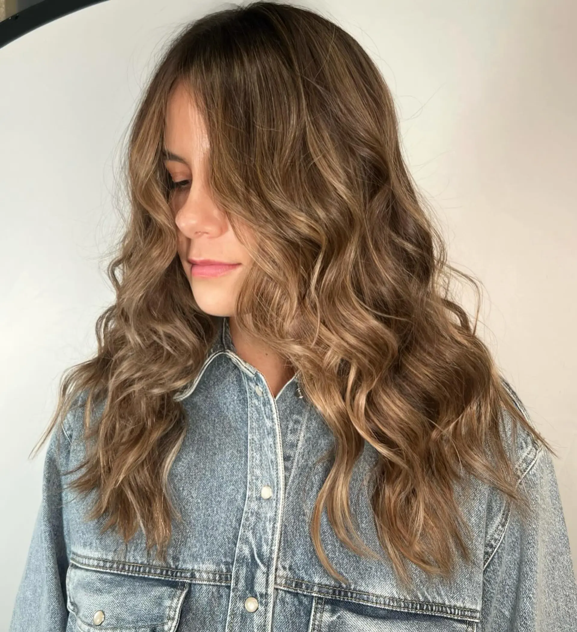 Long layered bronde waves achieved with balayage. 1
