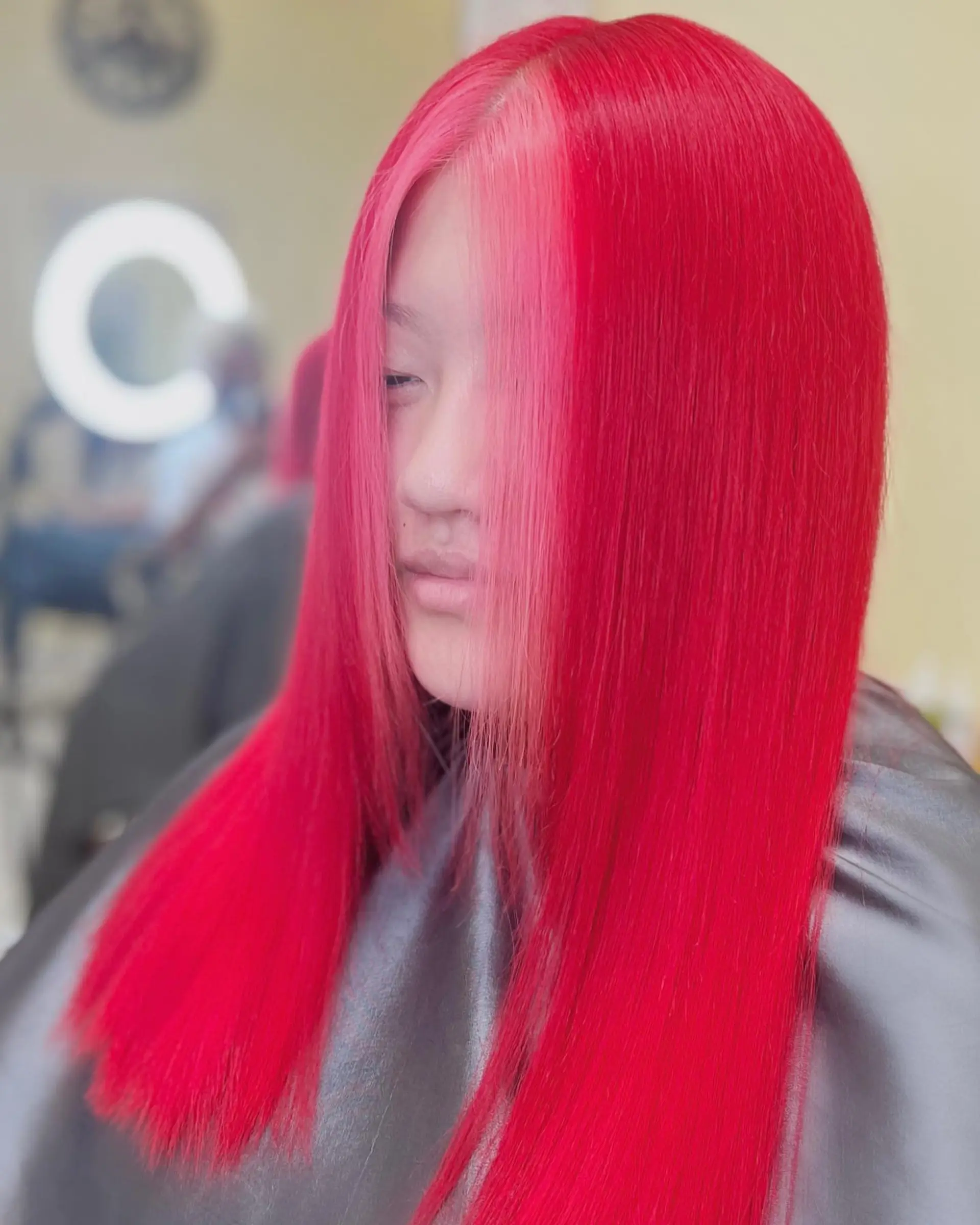 Long straight hair with a neon red color and contrasting pink money piece highlights. 1