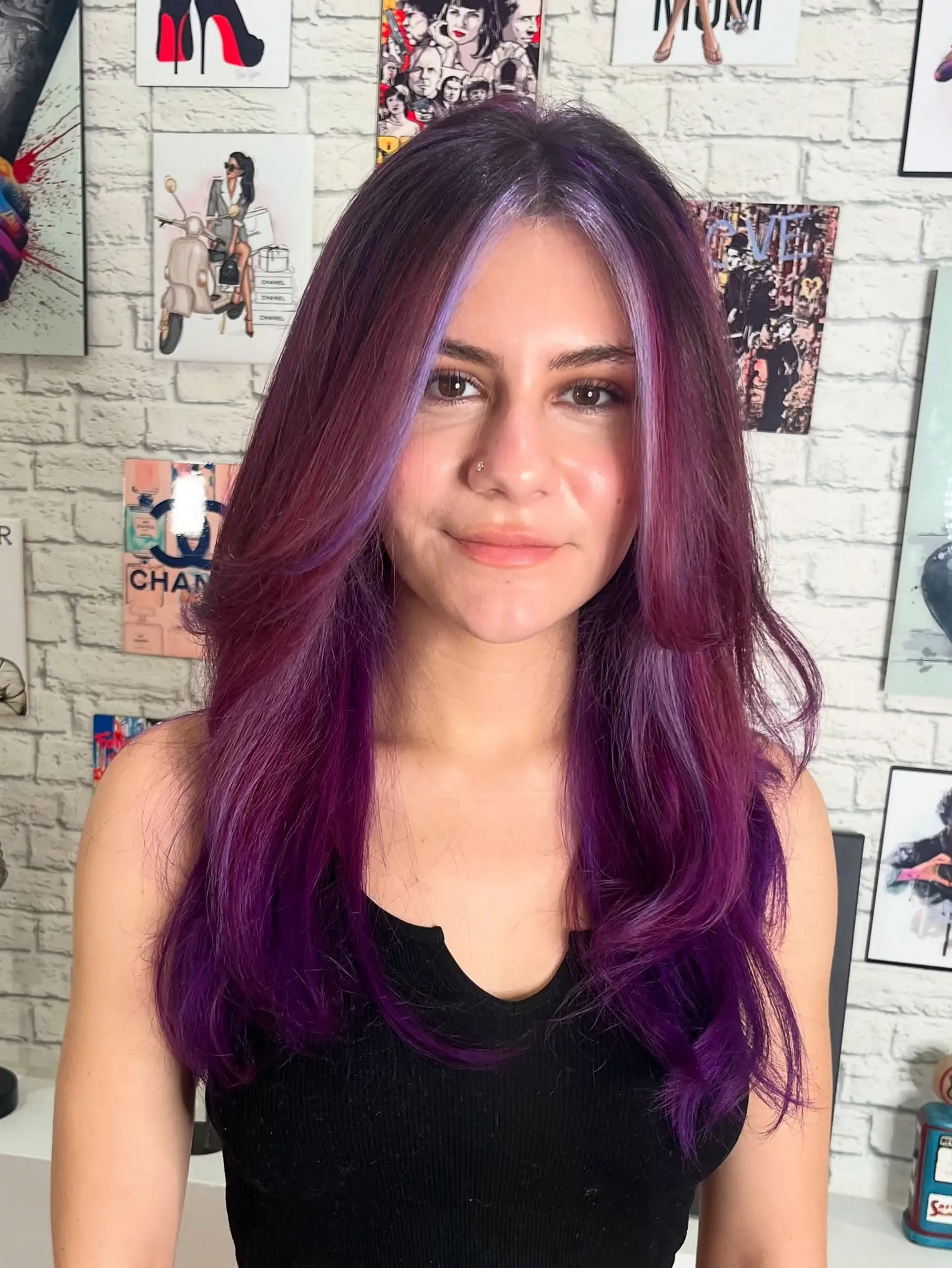 A medium-length layered haircut with face-framing layers, styled with a vibrant purple and burgundy color combination. 2