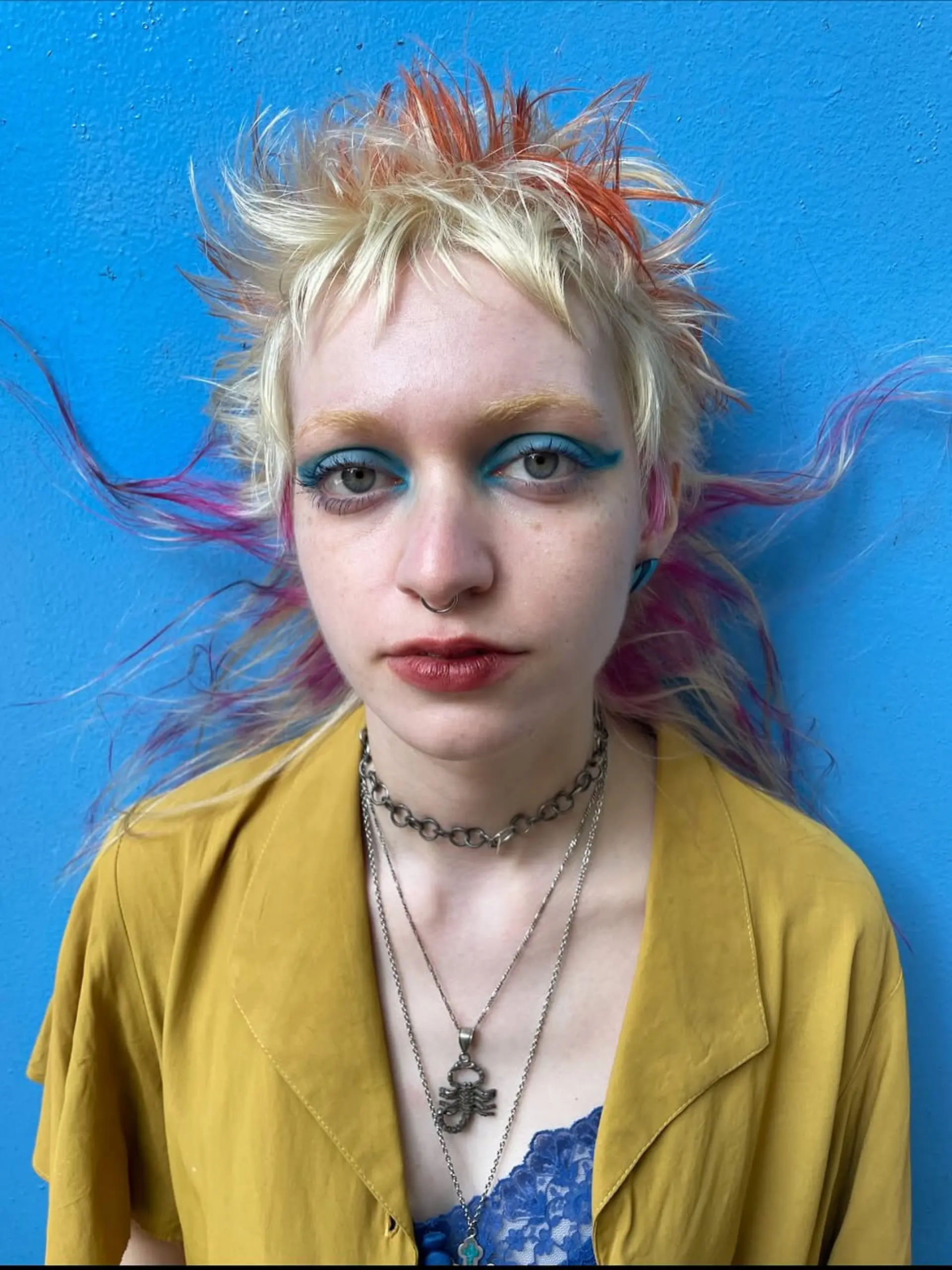 A textured shag-mullet hybrid with choppy, voluminous layers and multi-tonal chunky vivid highlights. 1