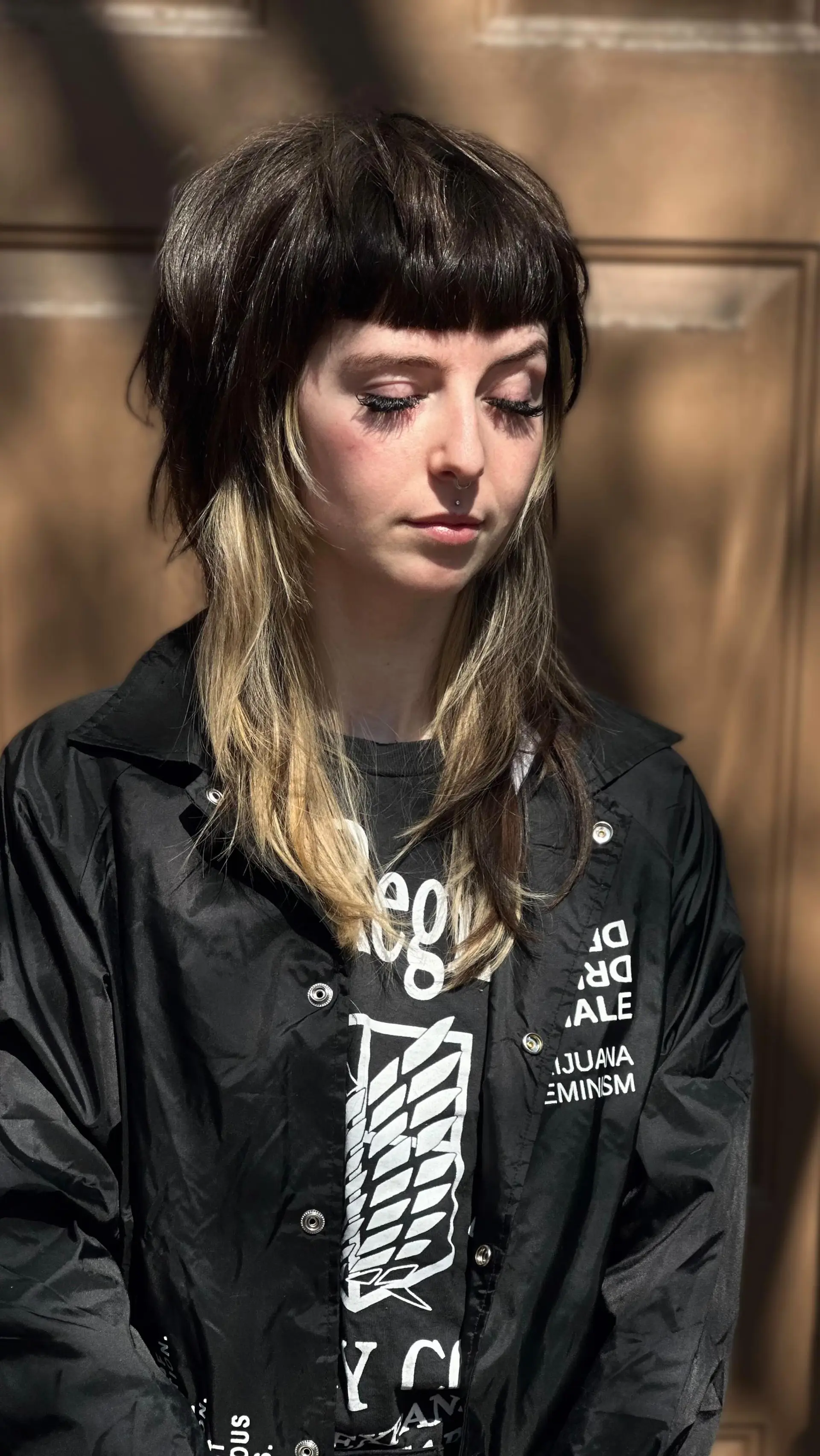 A textured razor shag with blunt micro fringe, piecey face-framing layers, and contrasting blonde ends. 1
