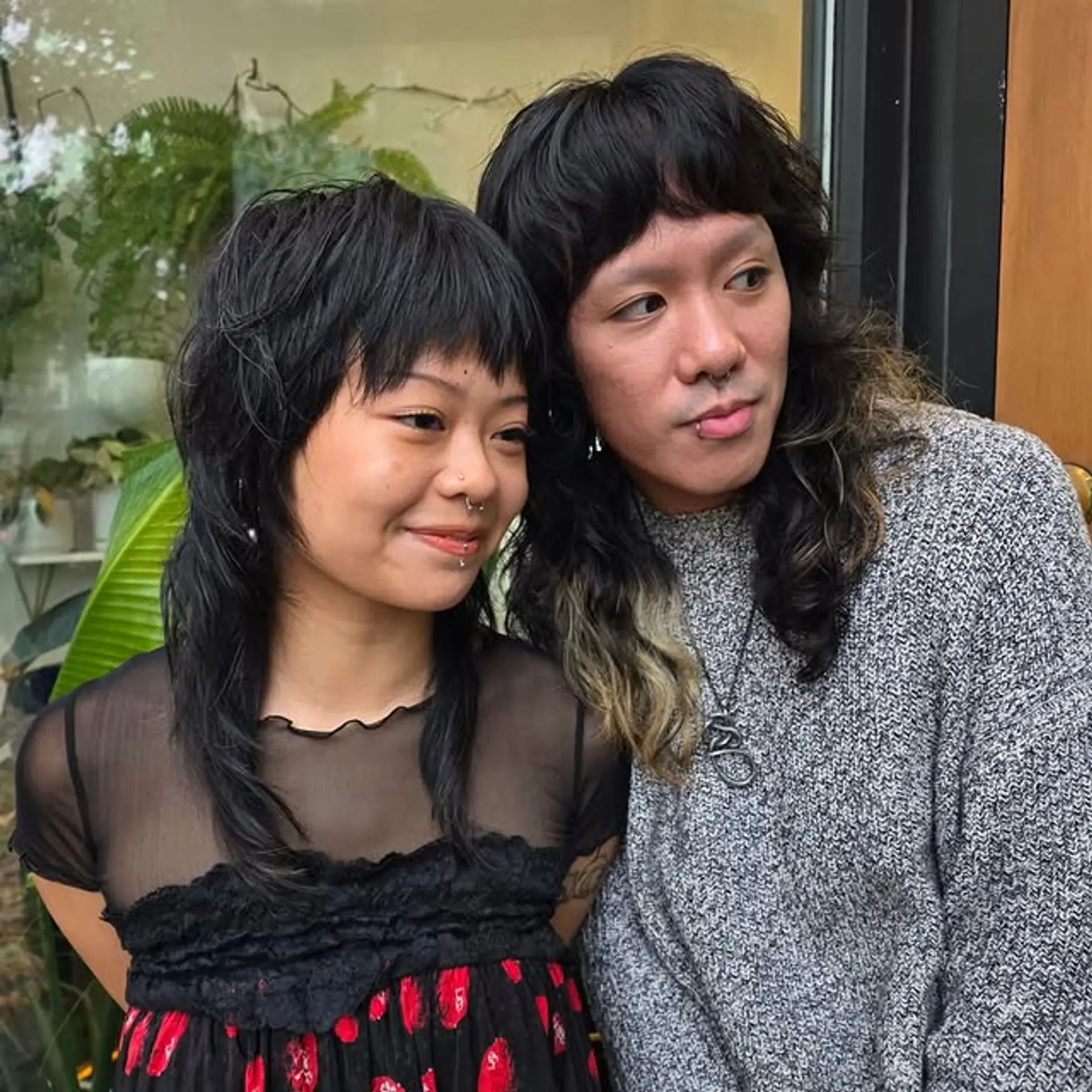 A shaggy mullet with bangs, styled with choppy layers for an edgy, alternative look. 1