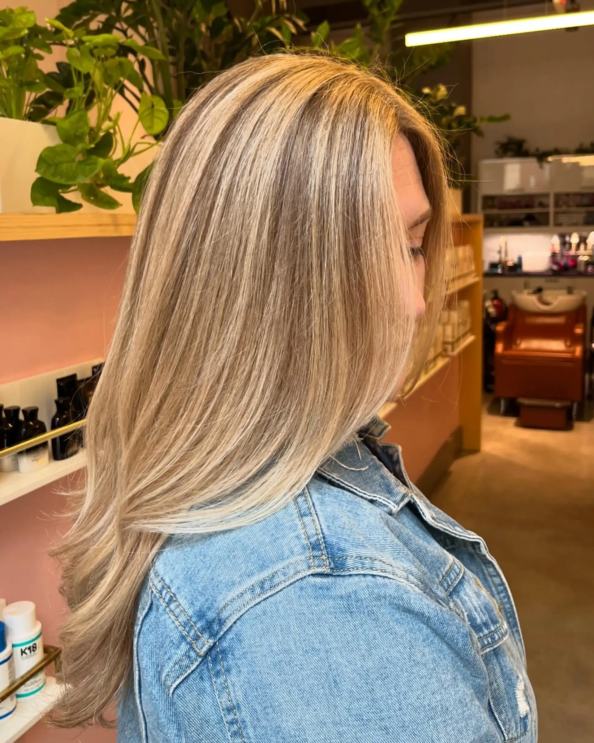 Smooth, long straight hair featuring a dimensional, multi-tonal blonde balayage with soft ends. 1