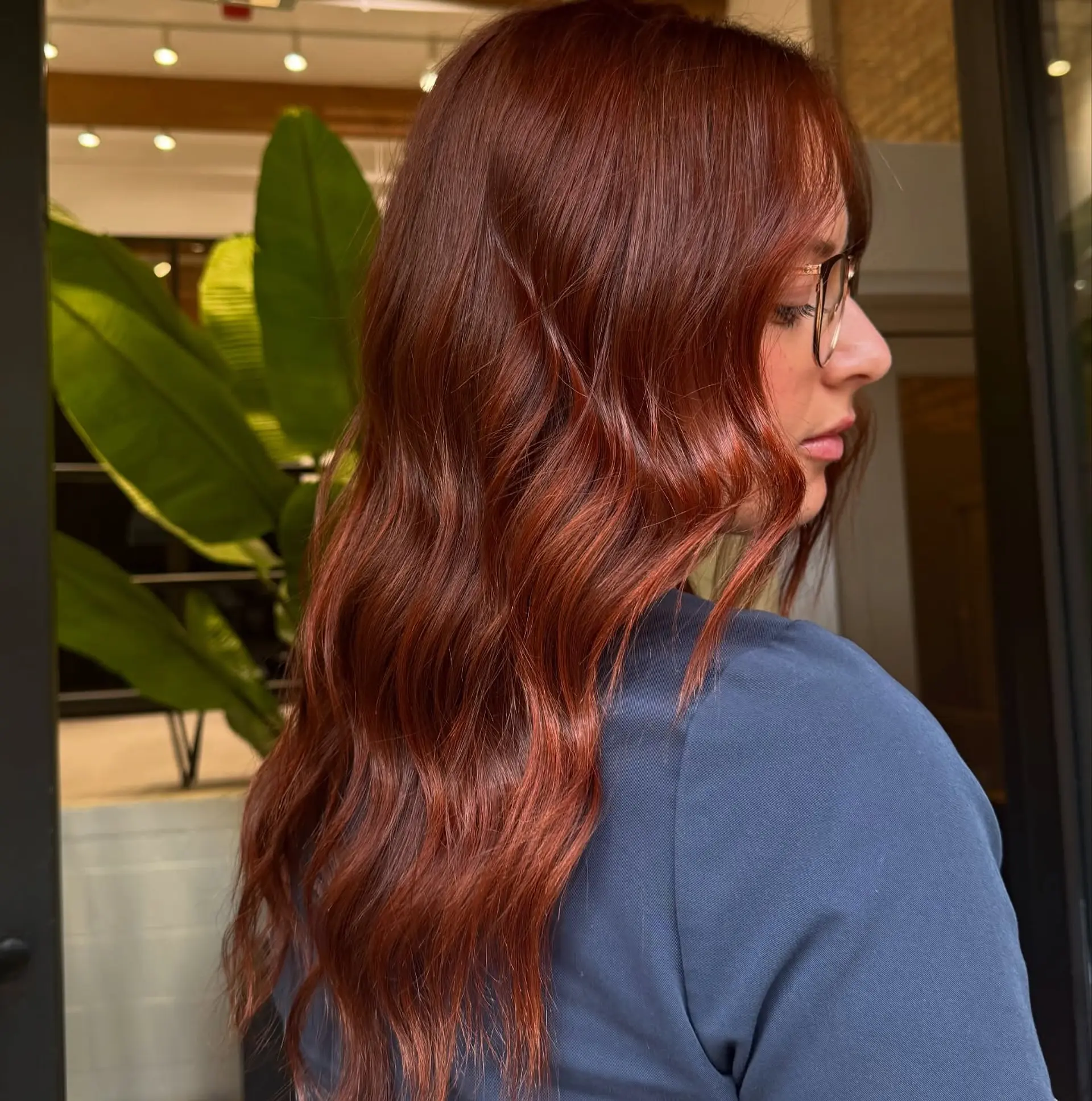 Long, wavy hair with a copper red color and natural looking waves. 1
