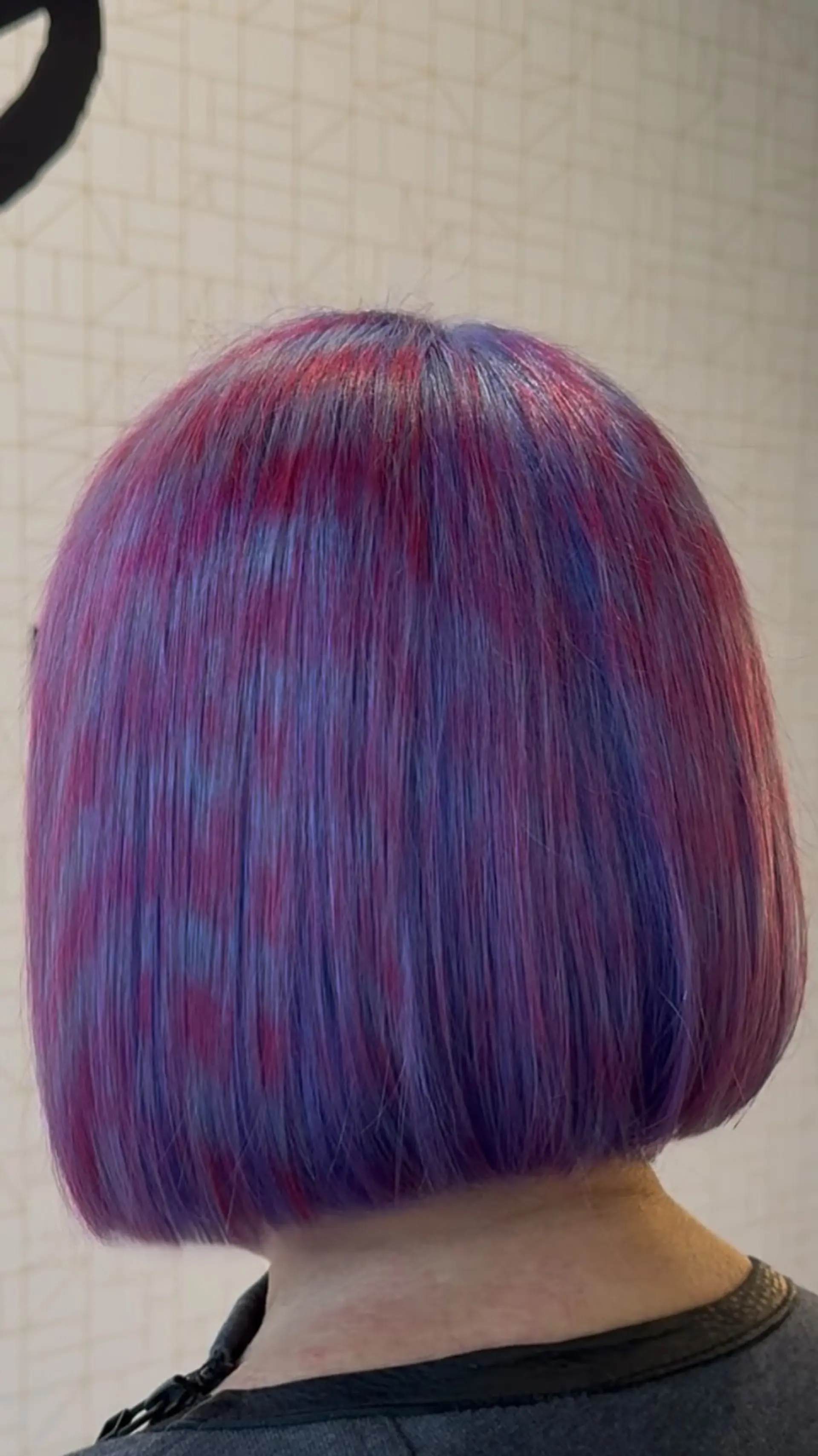 A sleek, straight blunt bob styled with creative patterned colorwork in shades of violet and magenta. 1