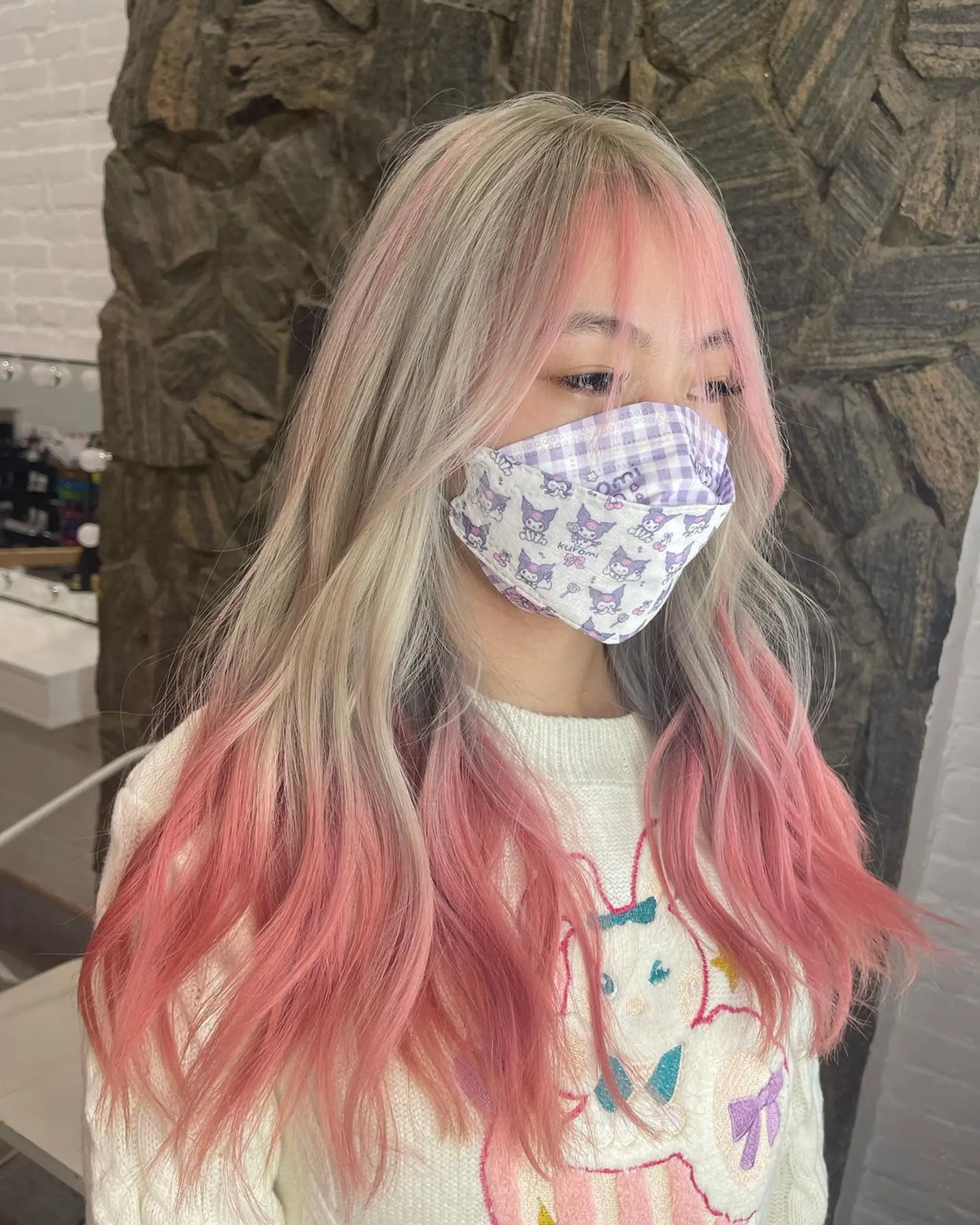 Long, straight hair with a blonde to pink ombre, featuring blunt bangs and a soft wavy texture.