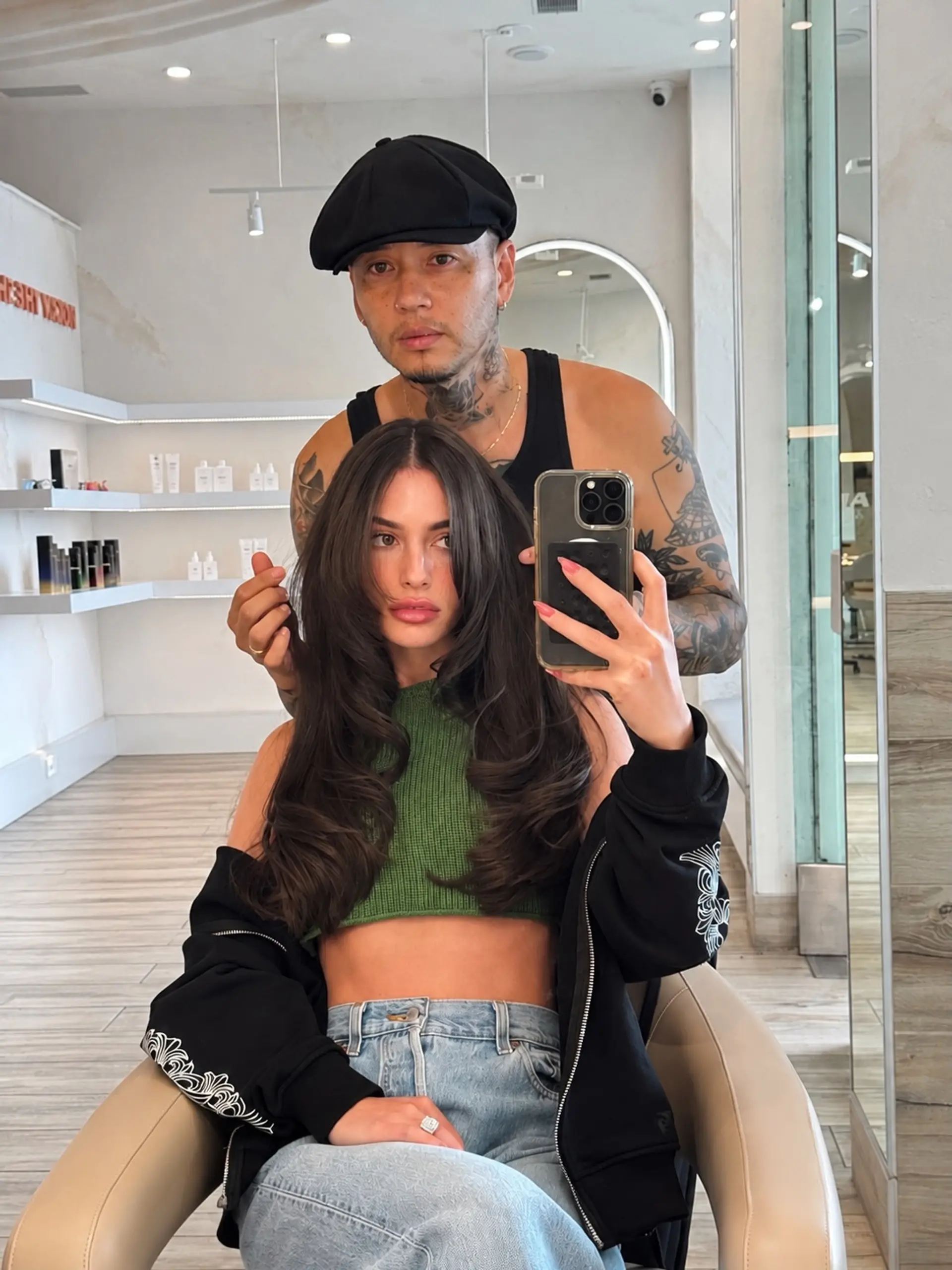 Voluminous long layered haircut featuring face-framing curtain layers and a bouncy blowout finish. 1