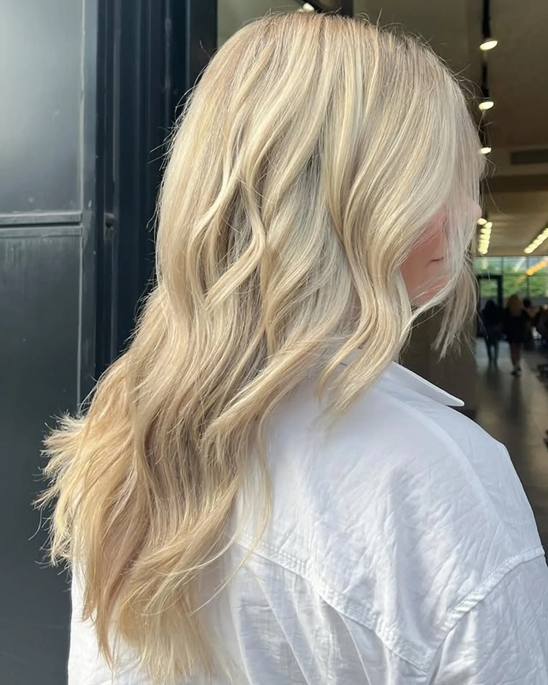 Long, beachy waves with rooted icy blonde color. 1
