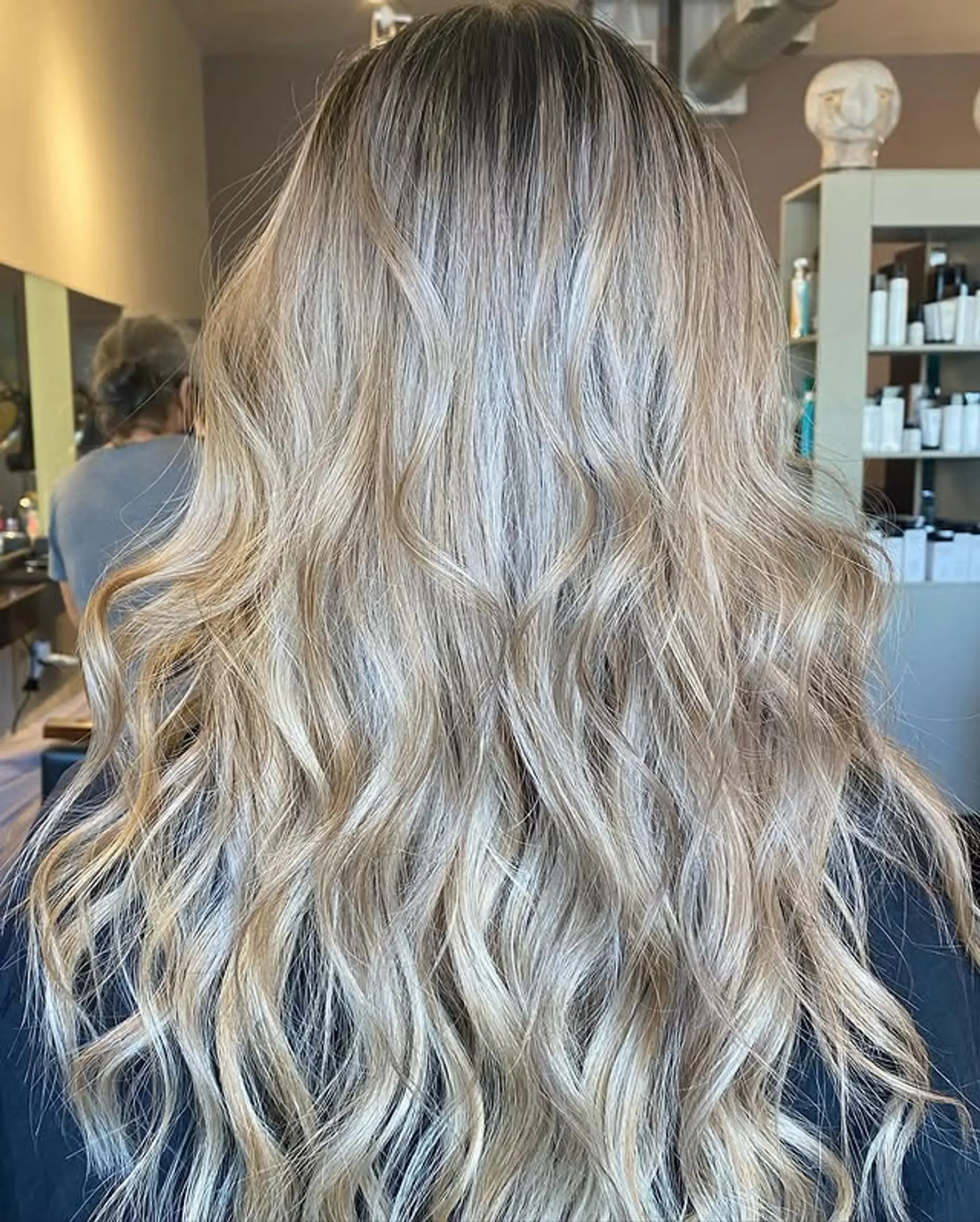 Long wavy hair with a blonde balayage. 1