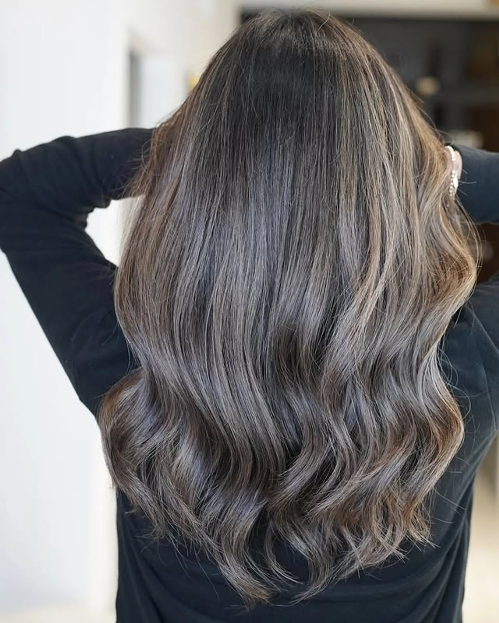 Long wavy hairstyle with an ash brown balayage. 1