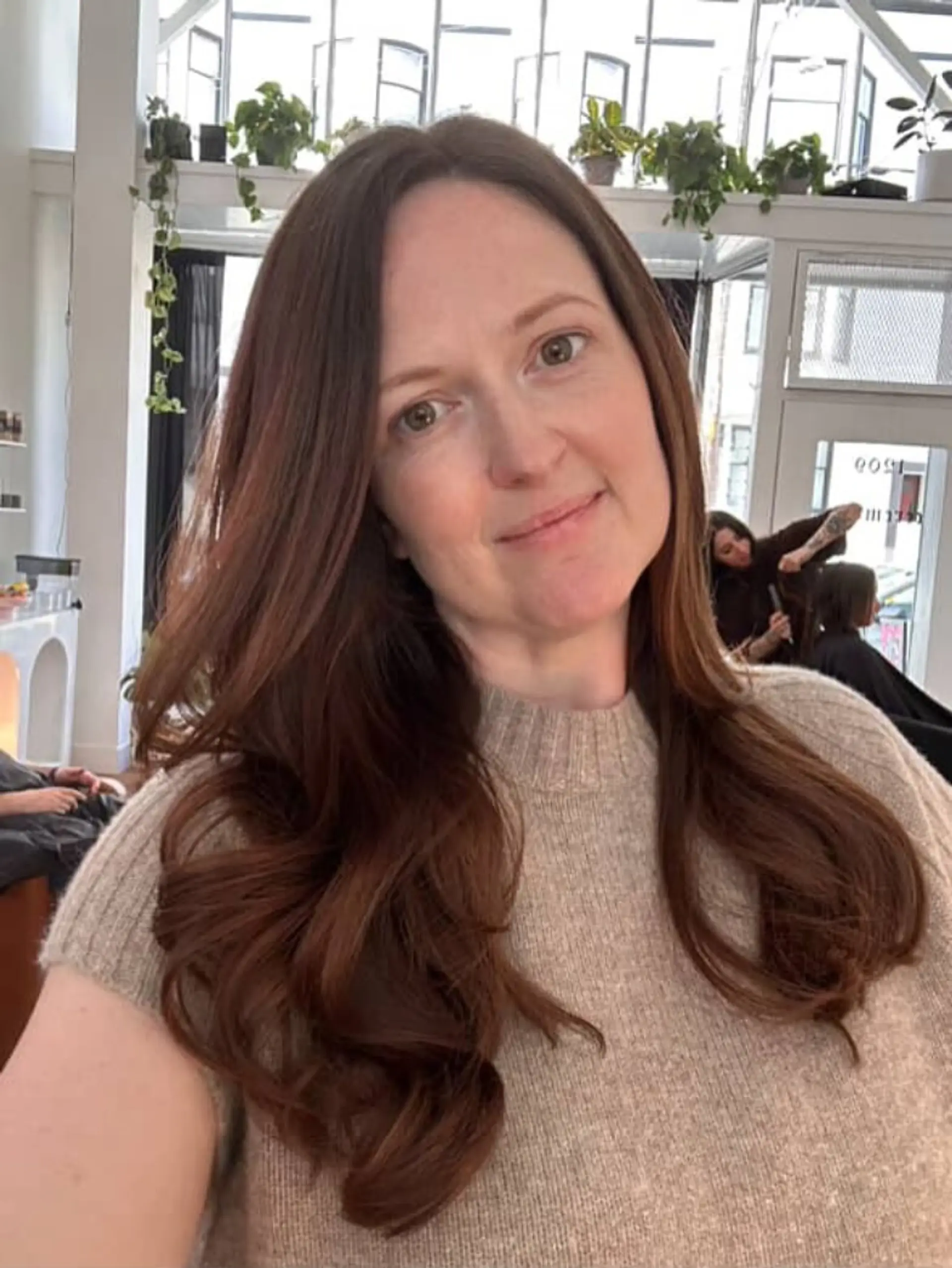 Rich auburn long hair styled into smooth, soft waves. 1