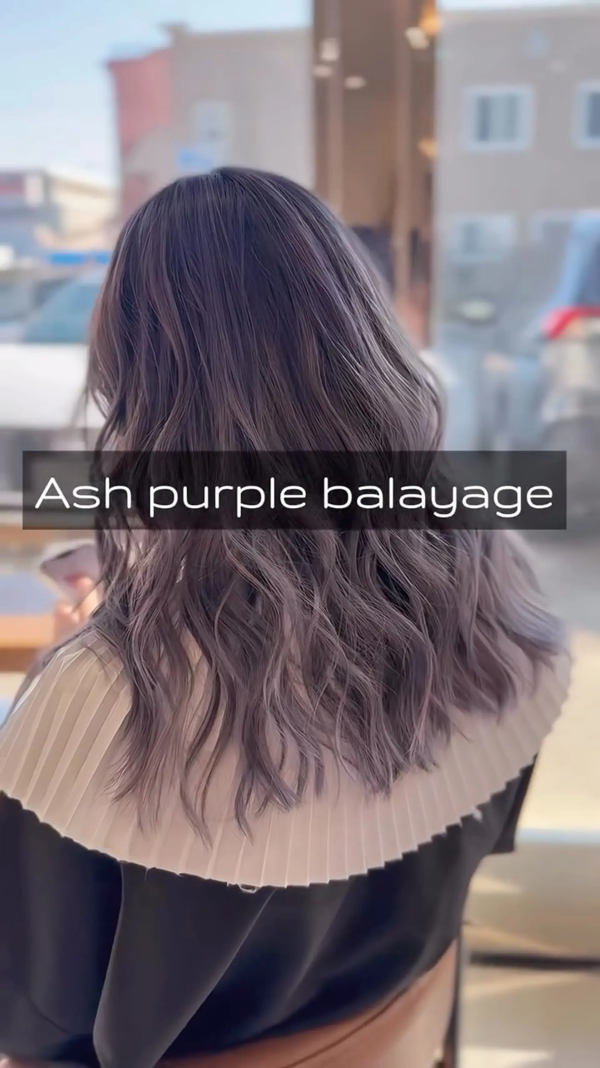 Long dimensional waves featuring a smoky ash purple balayage over a deep ash base. 1