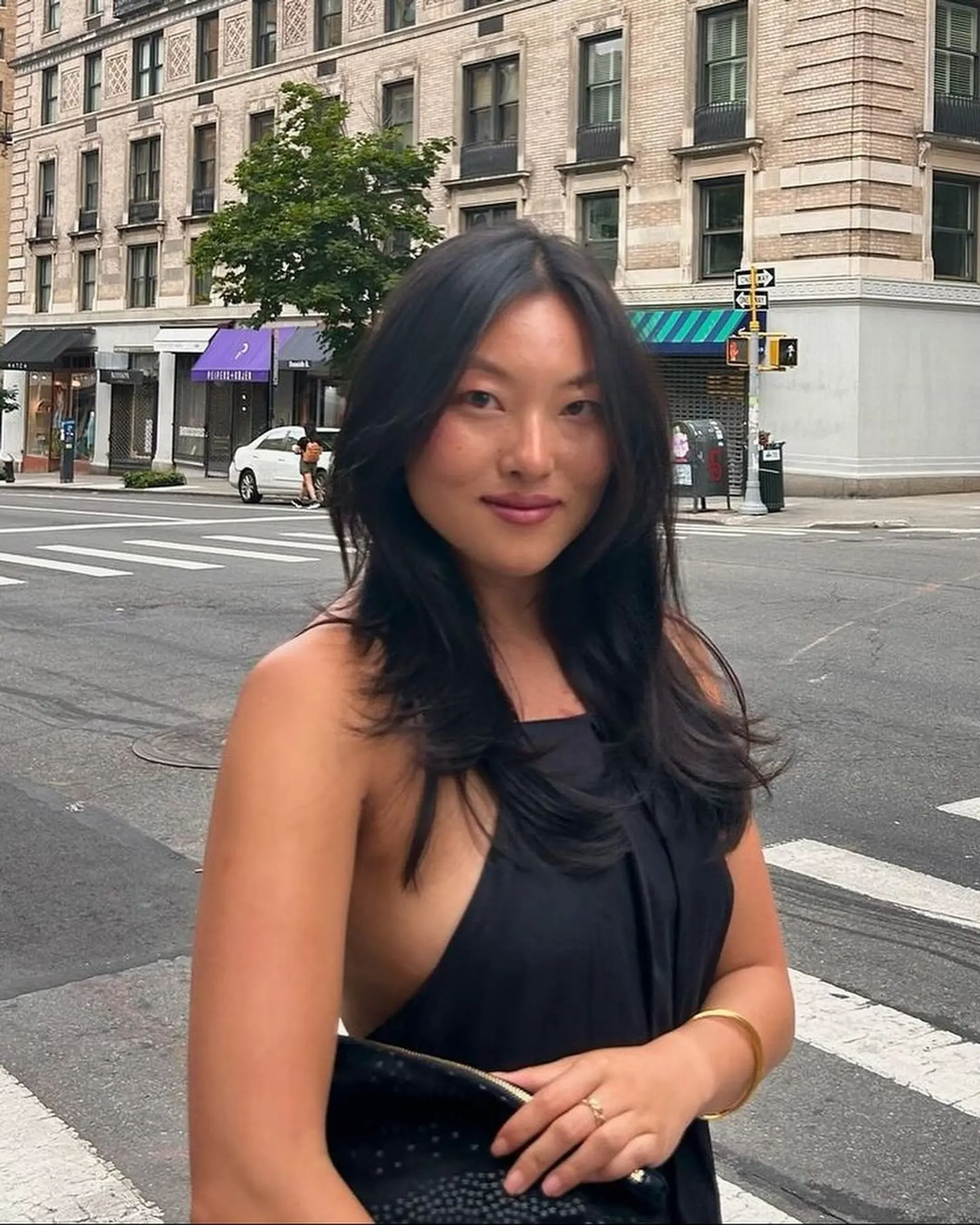 Long, straight, layered dark brown hair with a smooth and lustrous finish. 2