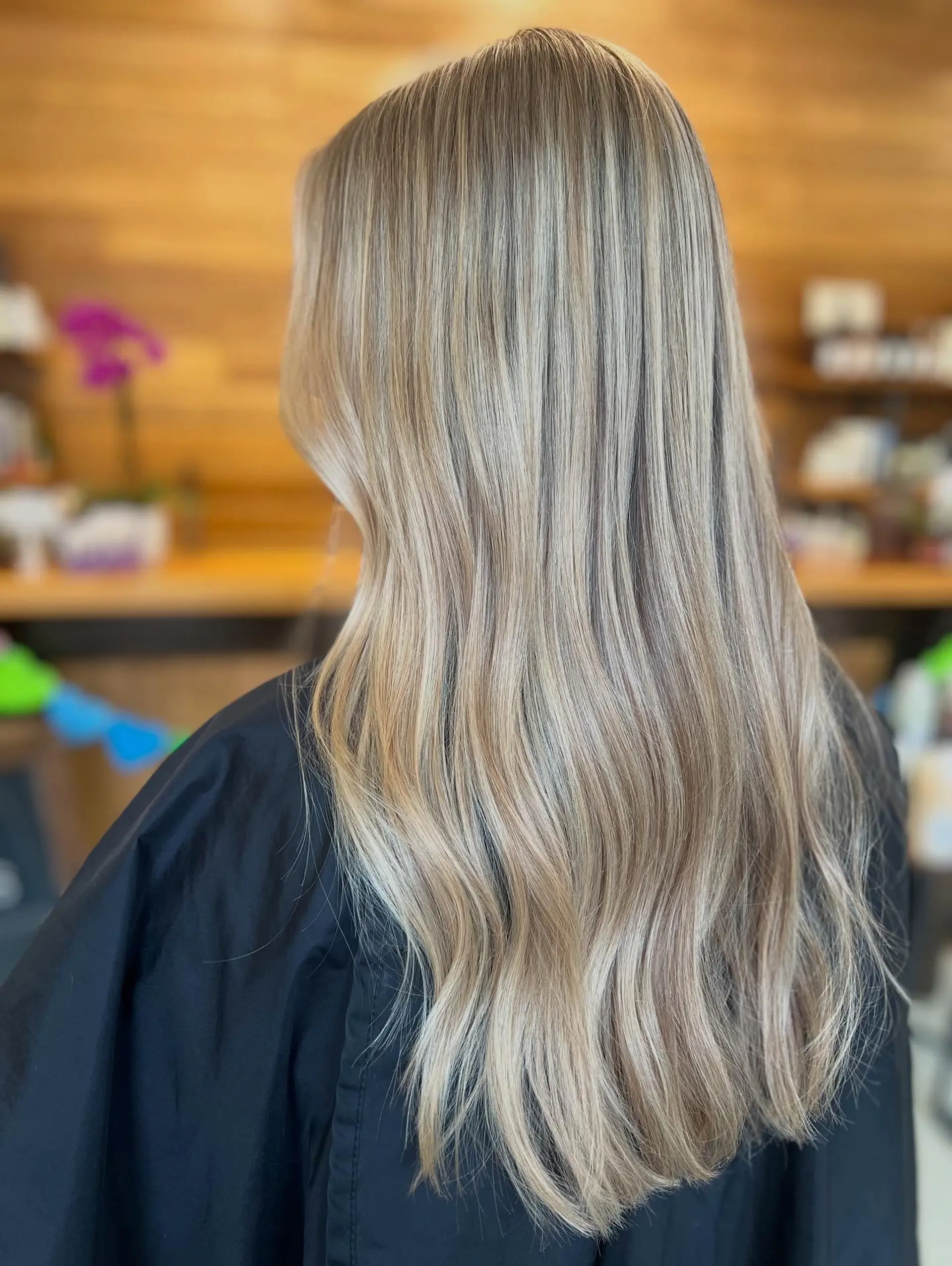 Long hair featuring a seamless, multidimensional blend of cool ash blonde and beige highlights transitioning softly from root to tip. 1