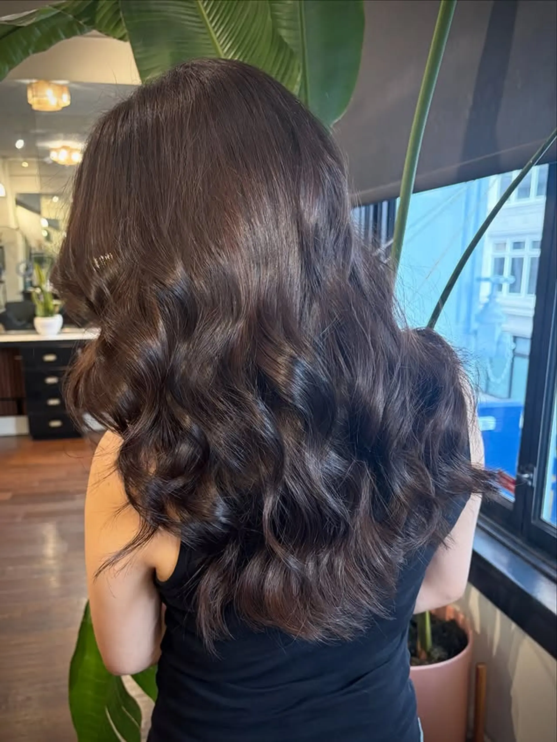 A long, wavy hairstyle with classic waves and layers. 1