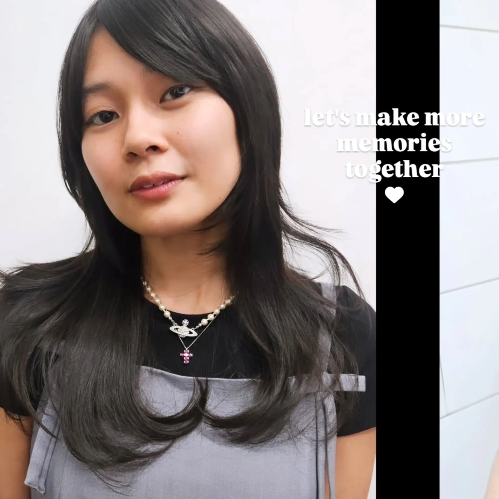 Medium-length layered haircut featuring textured face-framing pieces, side-swept bangs, and soft inward C-curl ends. 1