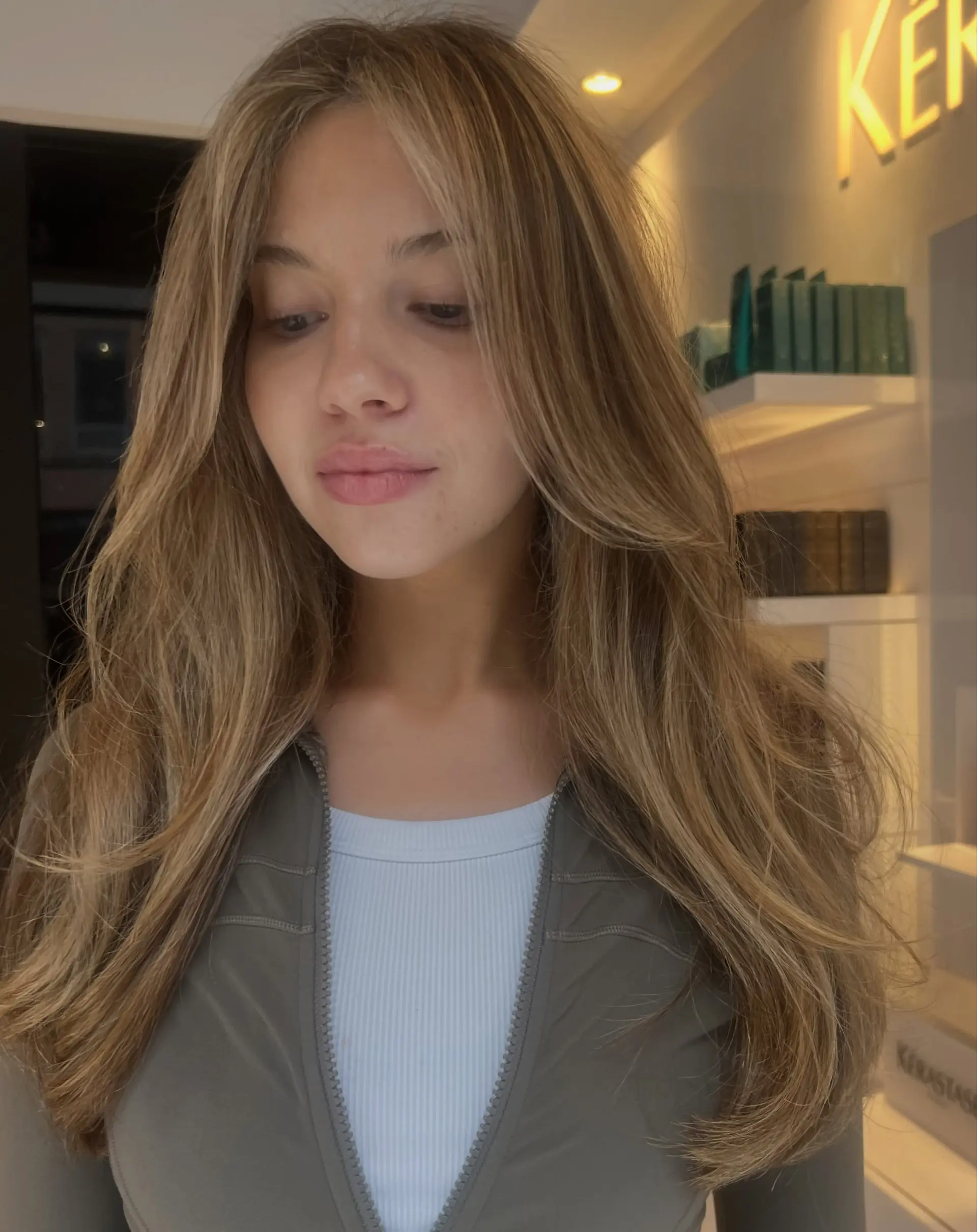 Long warm honey bronde hair with dimensional highlights and soft face-framing layers. 1