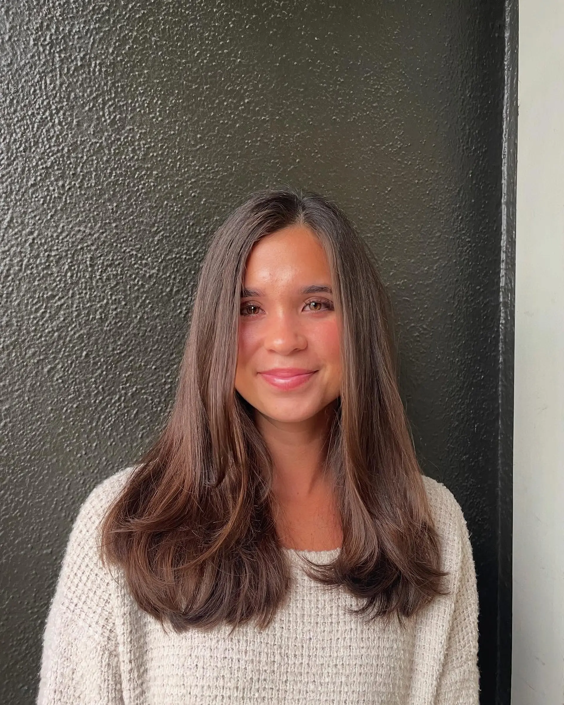 A long, layered haircut with face-framing layers. 1