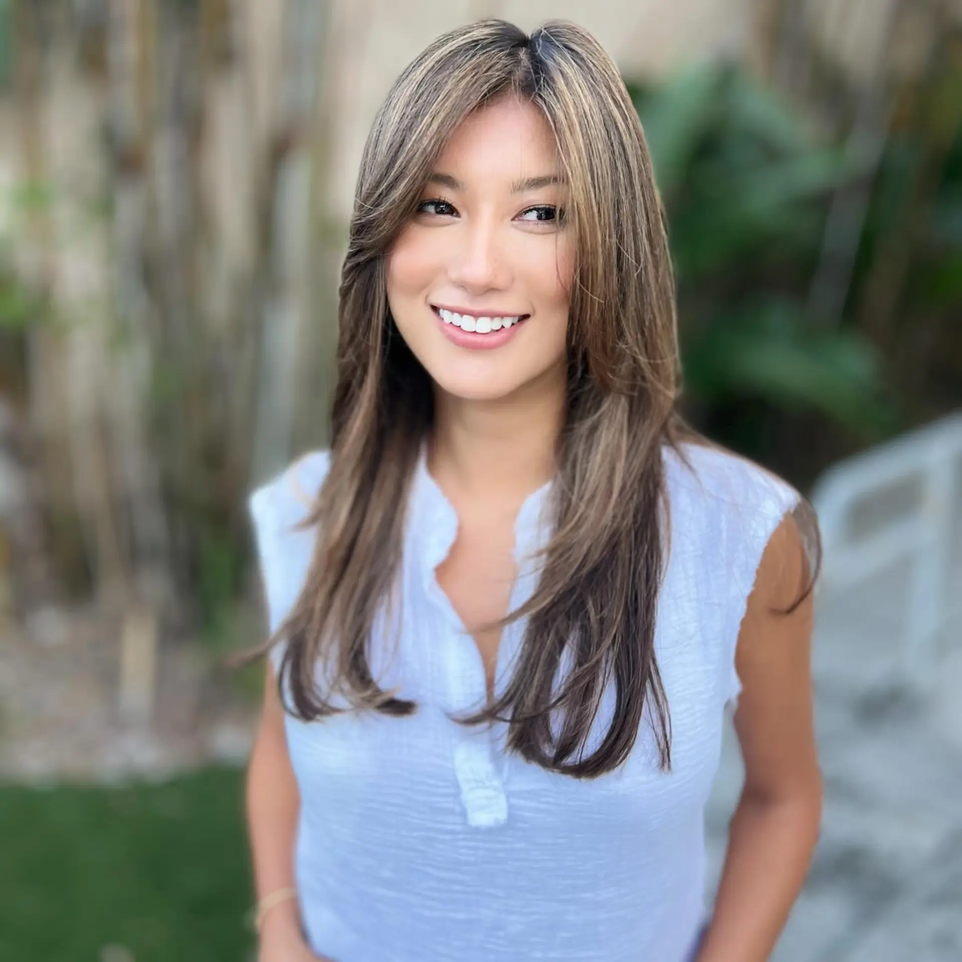 Long brunette hair with flattering layers and soft face-framing highlights. 1