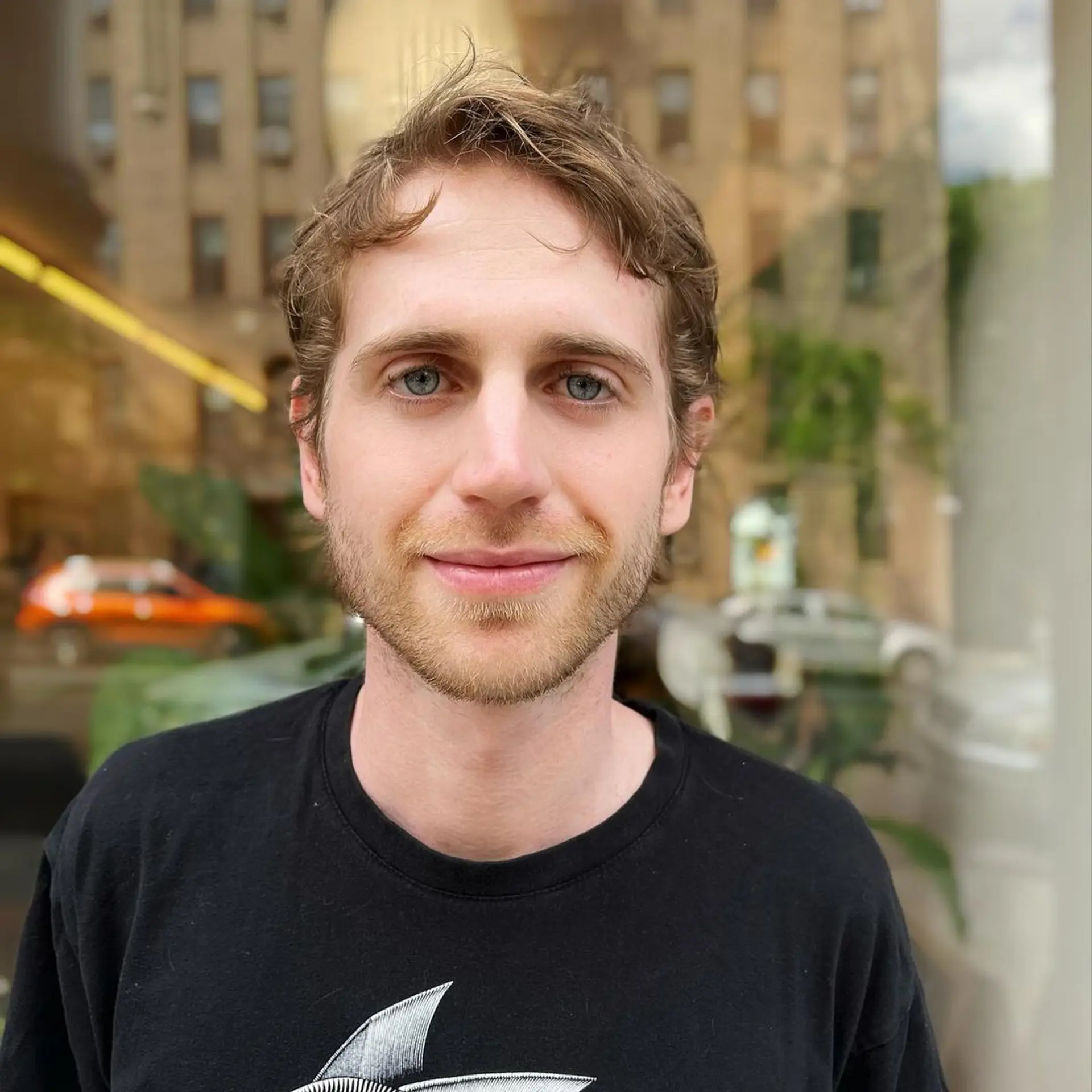 Light brown wavy hair with a short length. Front waves and layered cut create a casual and low-maintenance look. 1