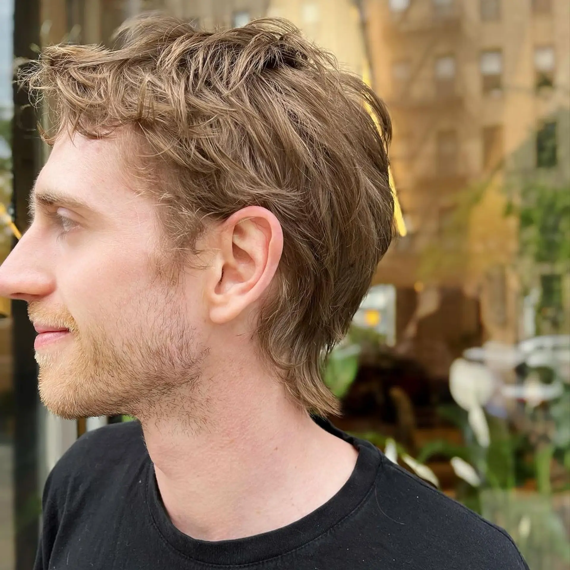 Light brown wavy hair with a short length. Front waves and layered cut create a casual and low-maintenance look. 2