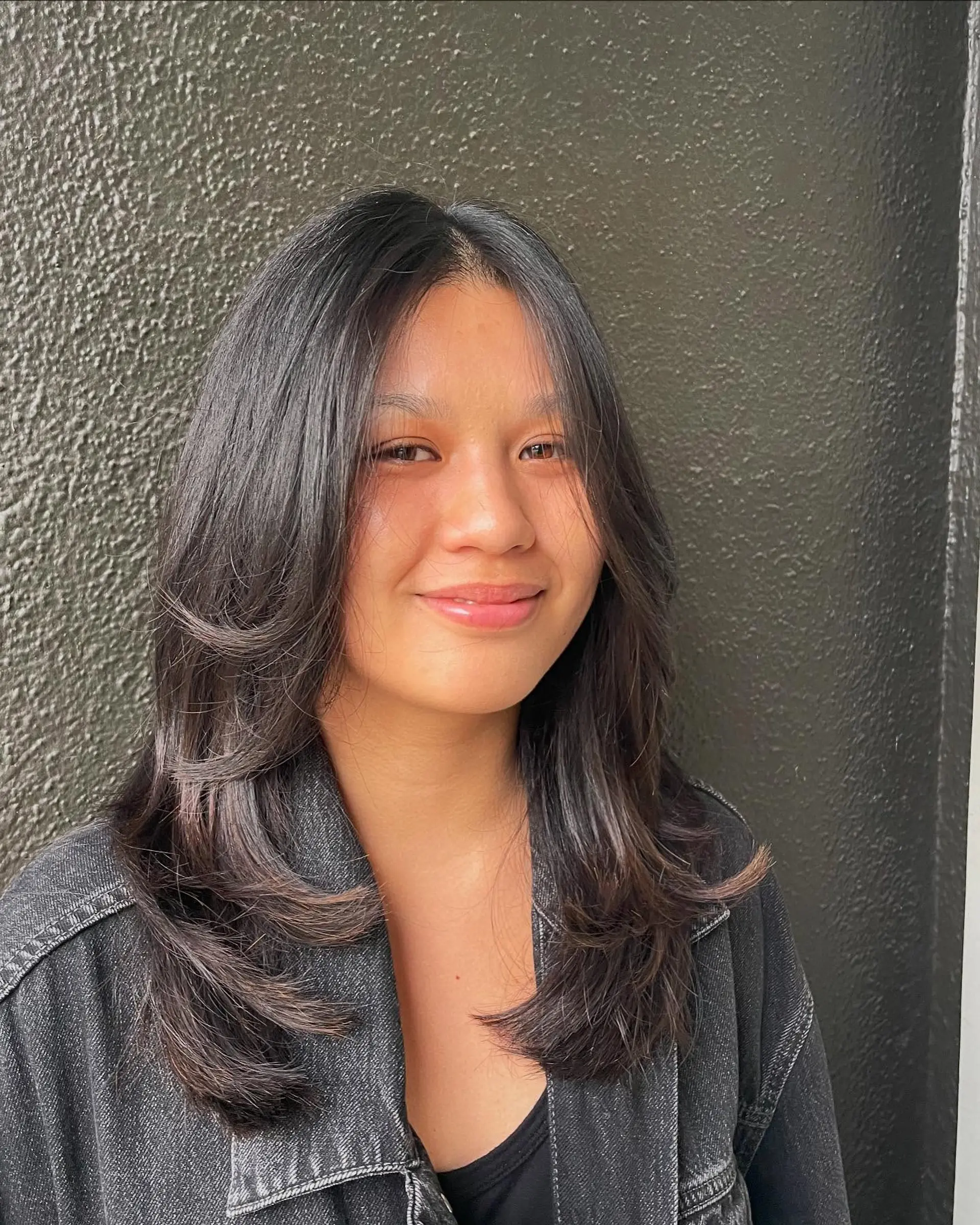 Long, layered cut with soft face-framing layers. 1