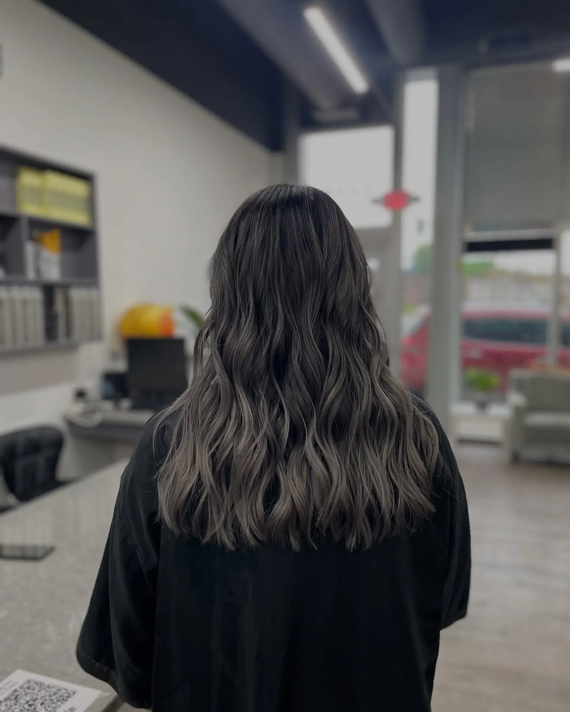 A layered long hairstyle with subtle waves. 1