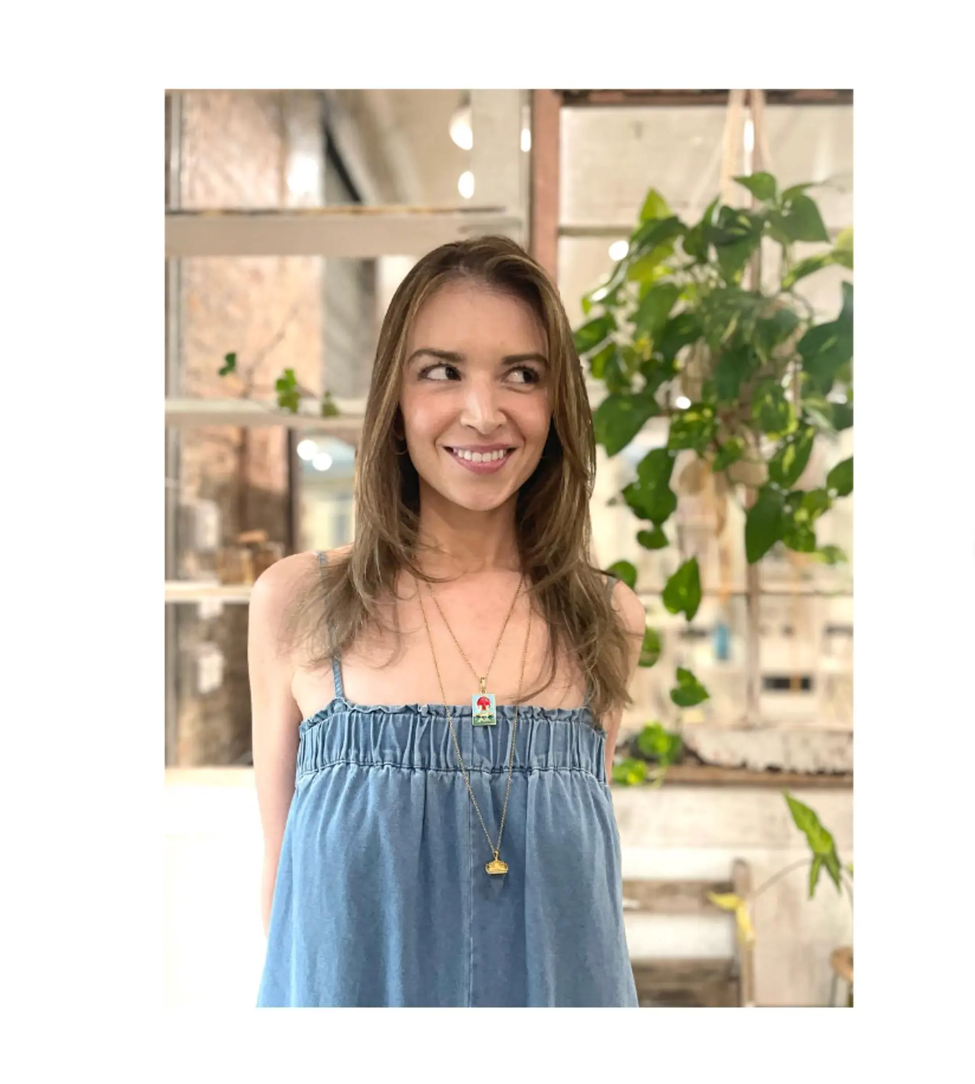 A layered medium-length hairstyle with a bronde color and face-framing layers. 1