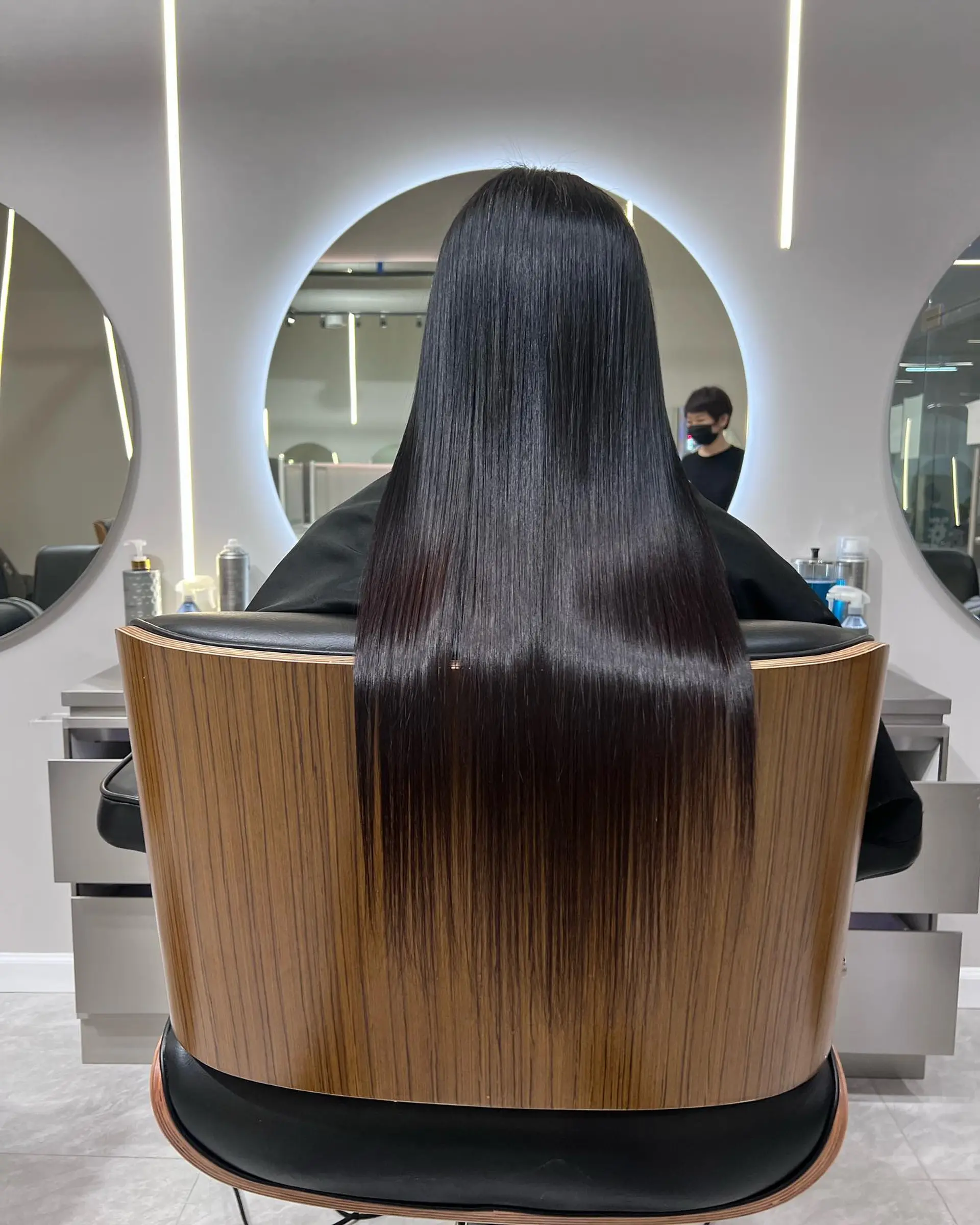 A sleek, very long straight hairstyle with a beautiful brunette balayage. 1
