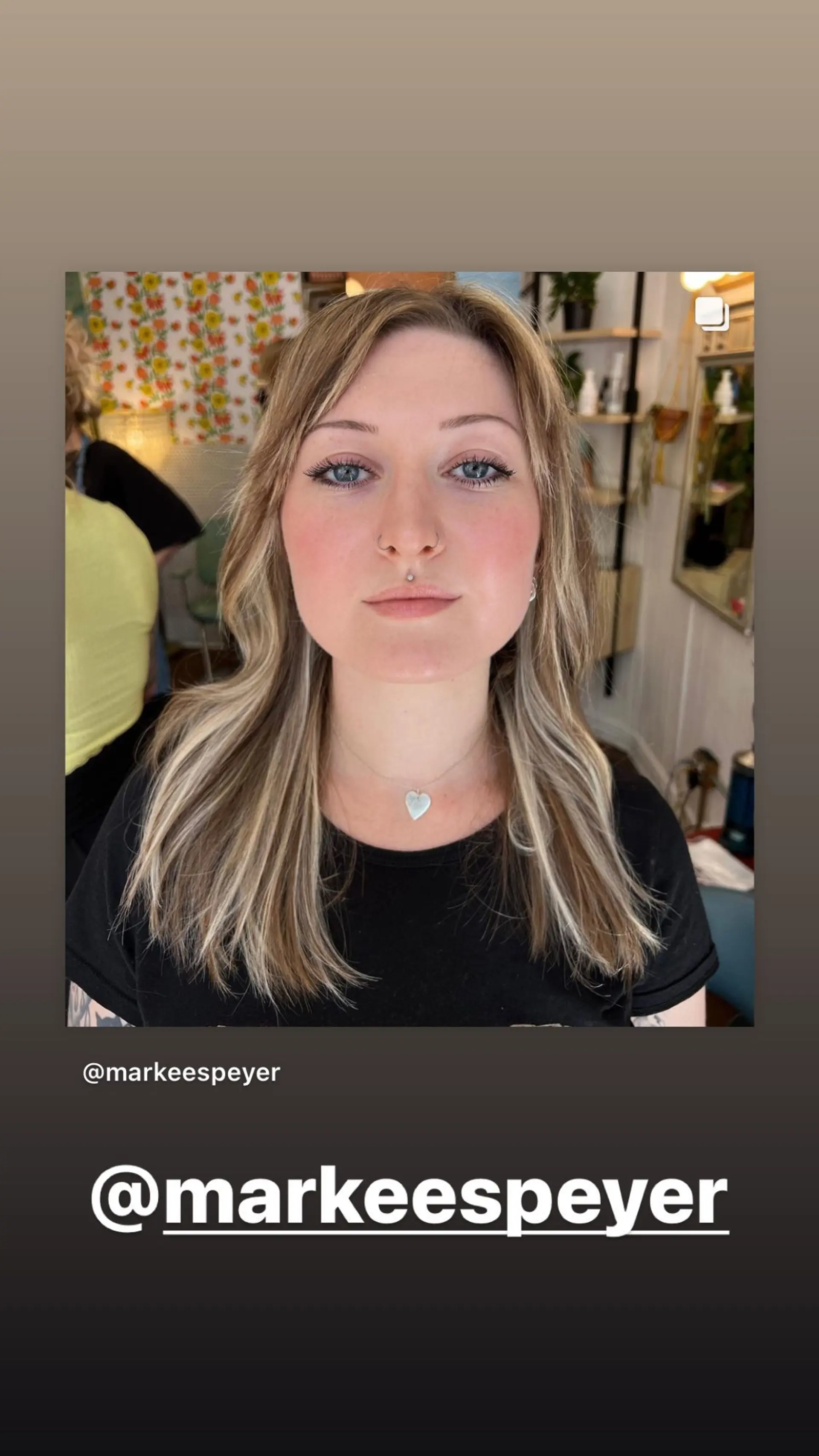 A medium-length wavy hairstyle with a cream blonde balayage and face-framing layers. 1