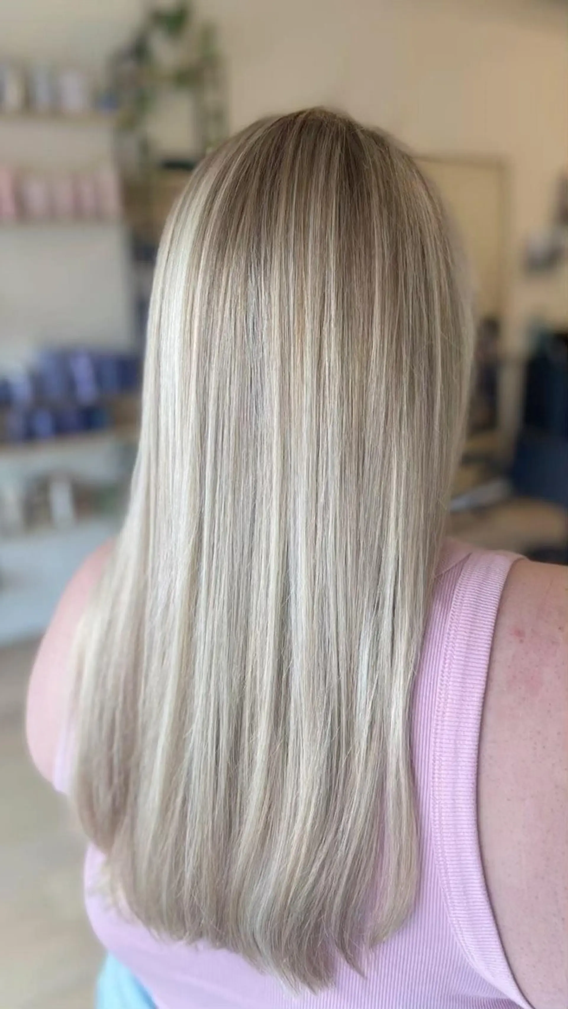 Long, silky straight hair with finely blended dimensional blonde highlights. 1