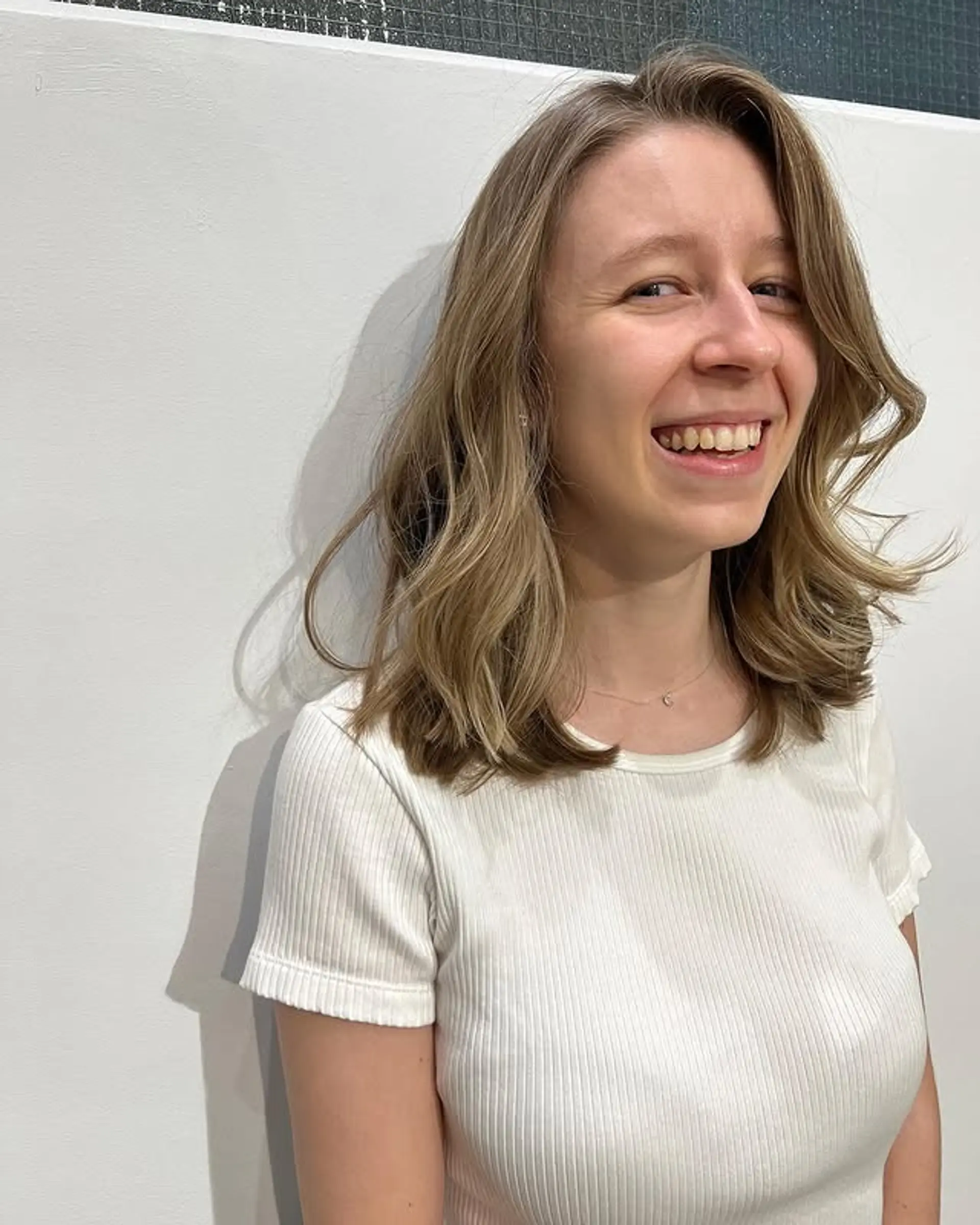 A medium-length wavy hairstyle with layers and beachy waves. 1