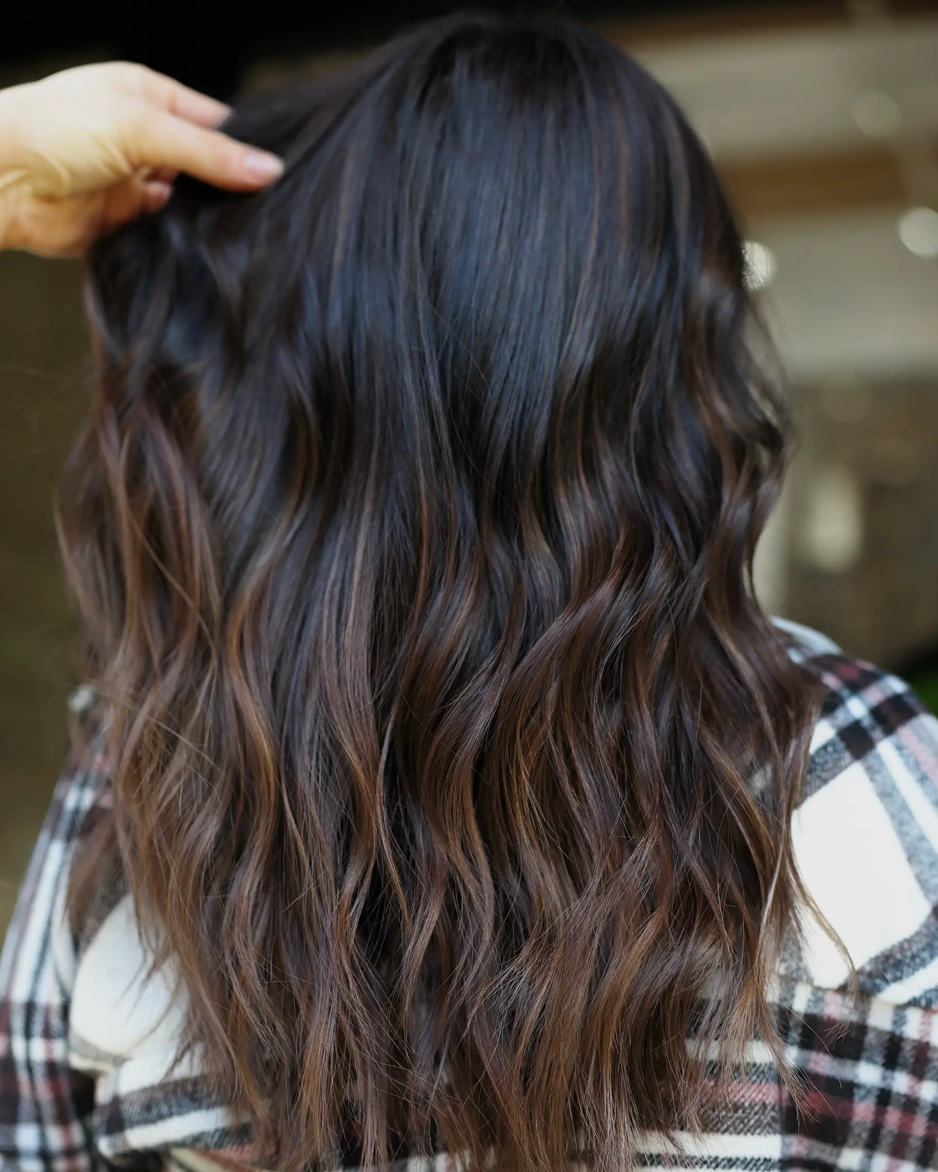 Long, wavy hair with a balayage and subtle brown highlights. 2