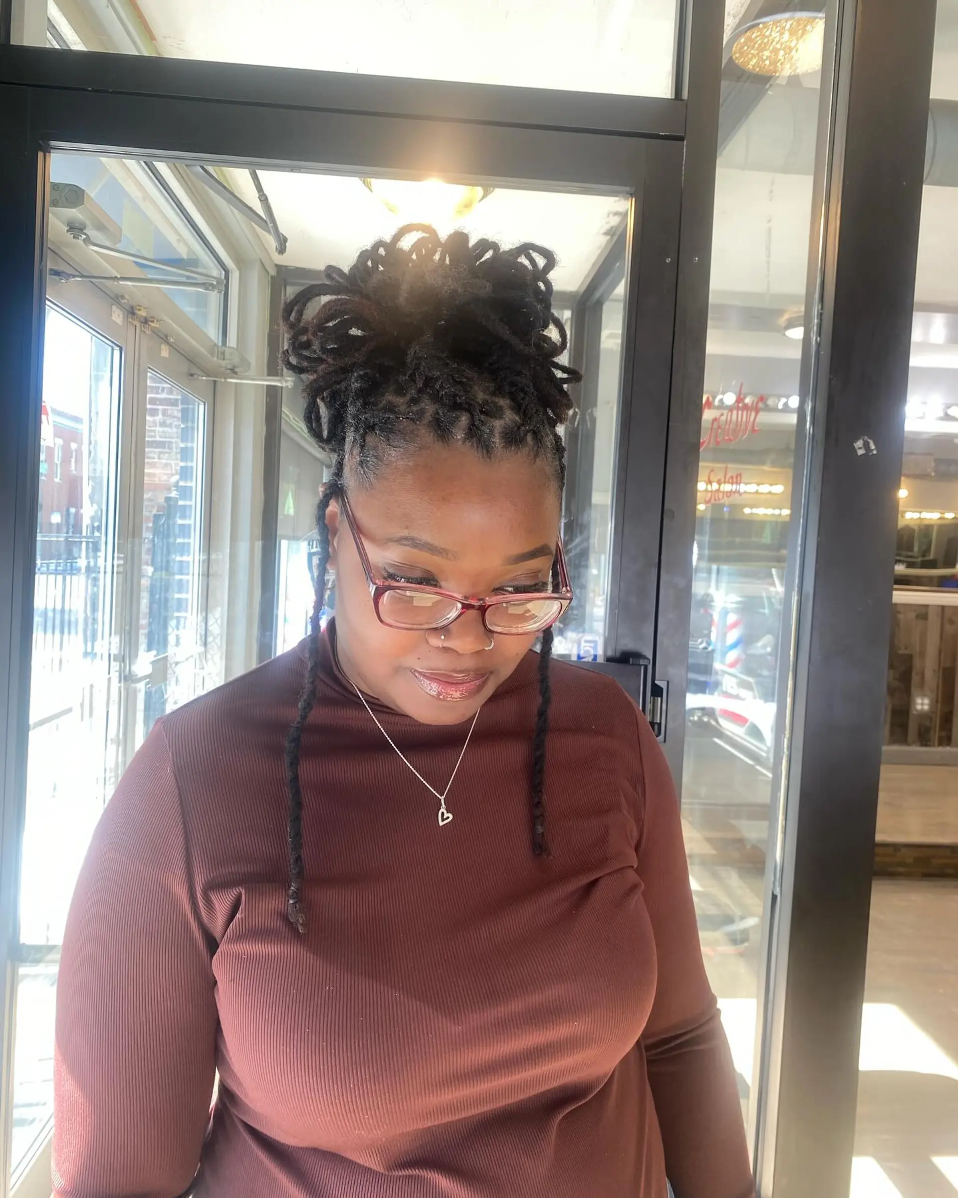 A stylish loc bun updo, perfect for a chic and effortless look. 1