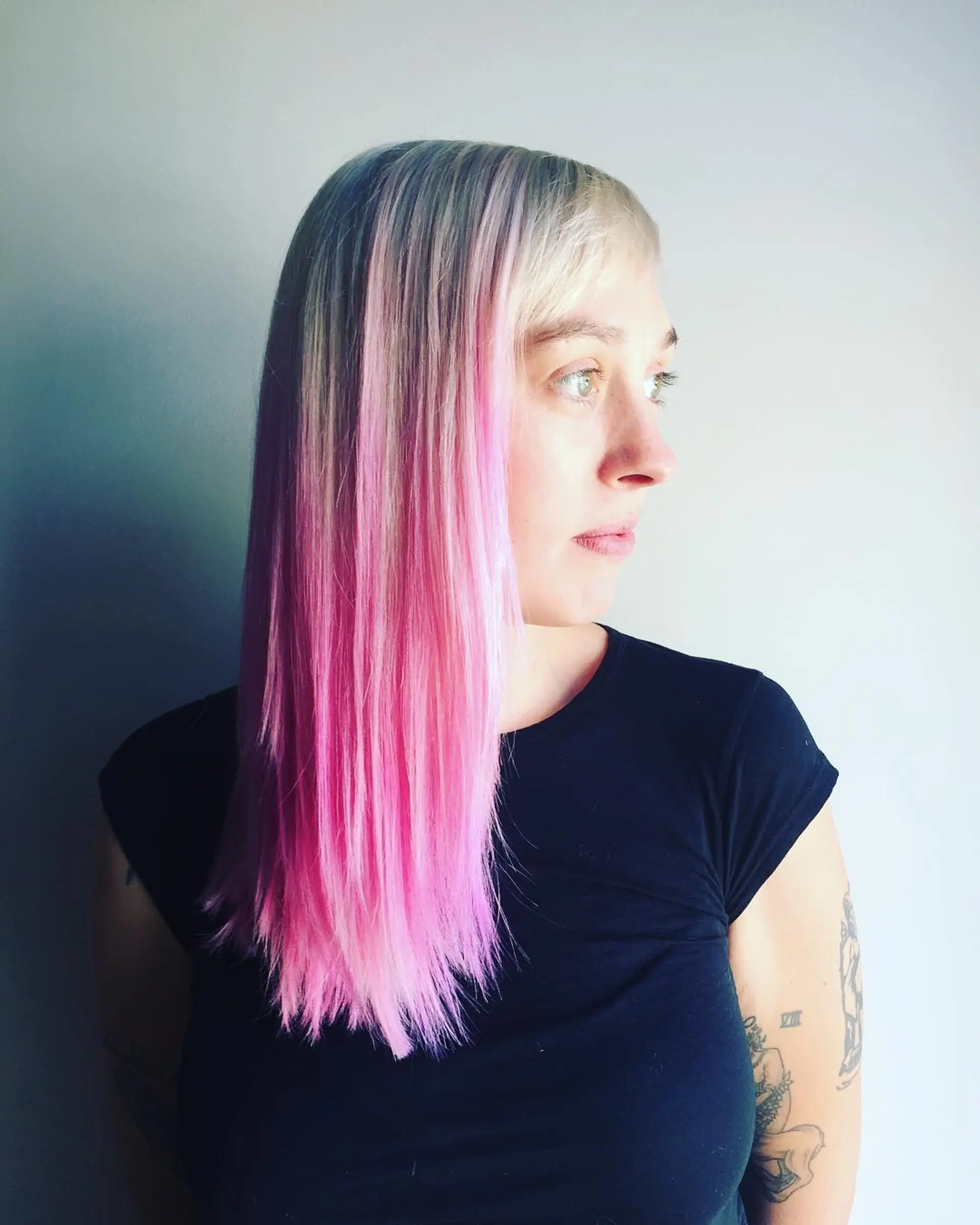 Long, straight hair with a blonde to pink ombre effect. 1