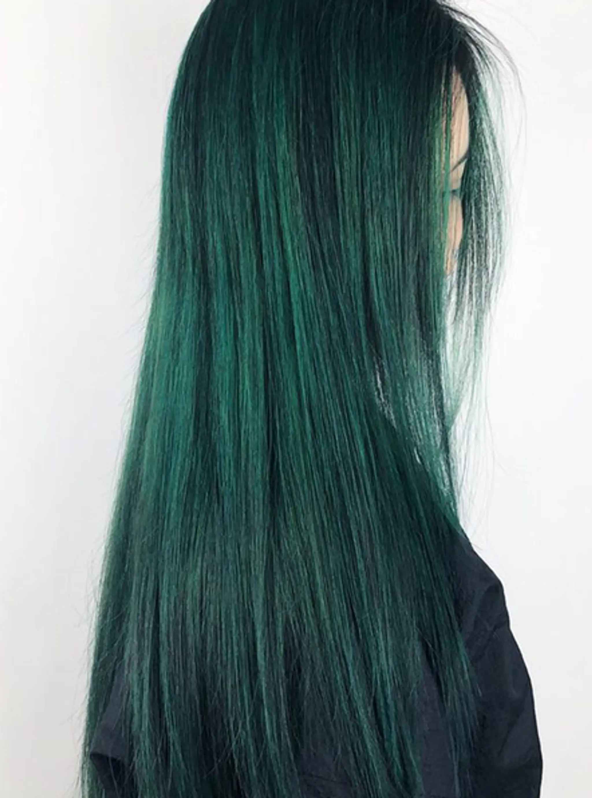 Sleek, very long, straight green hair.