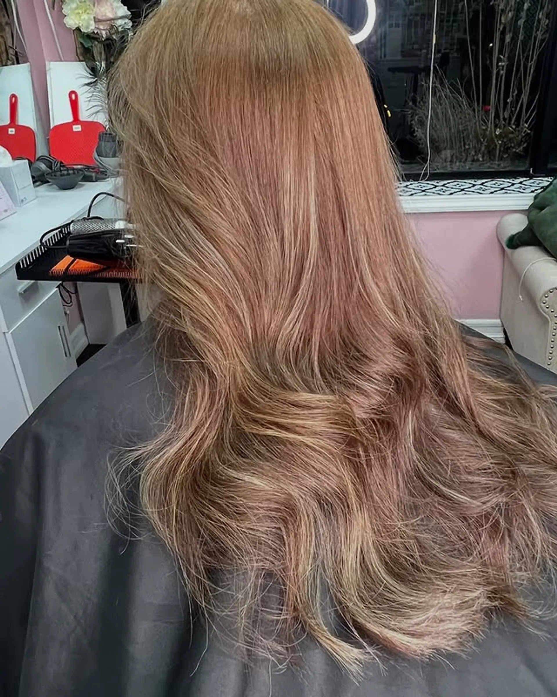 Long, layered waves with face-framing highlights. 1