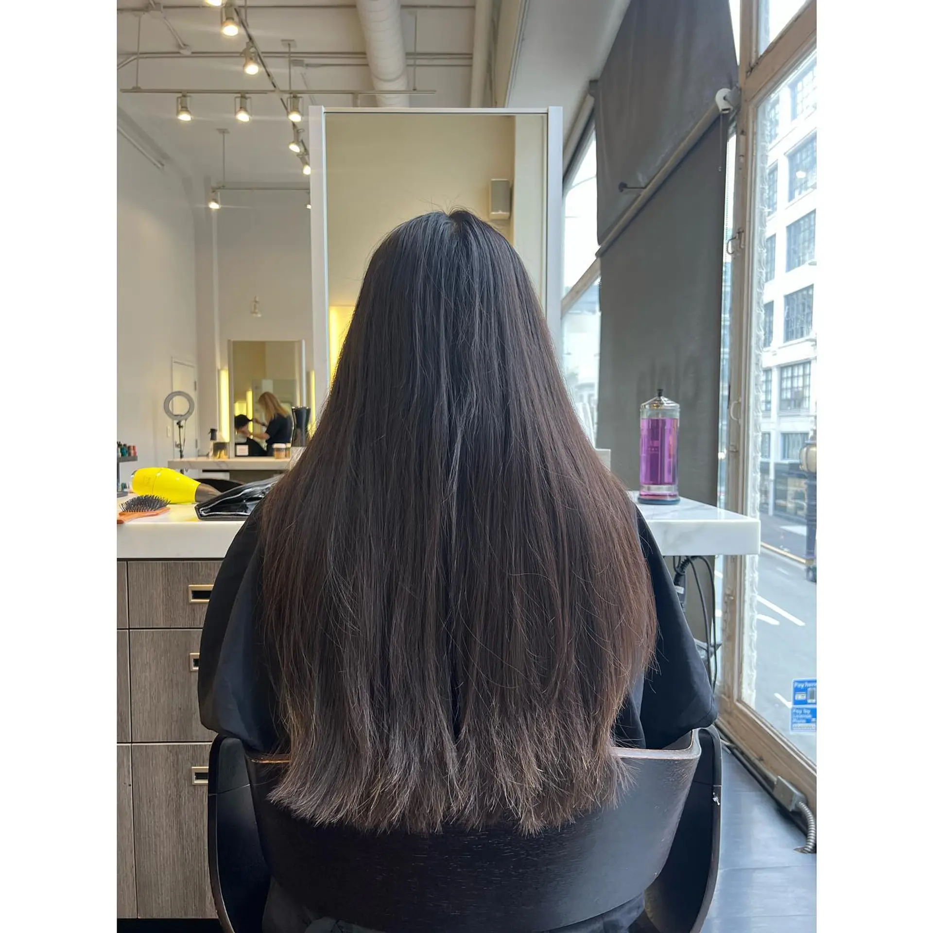 Straight, extra-long dark brunette hair cut with soft long layering and a full, even finish. 1