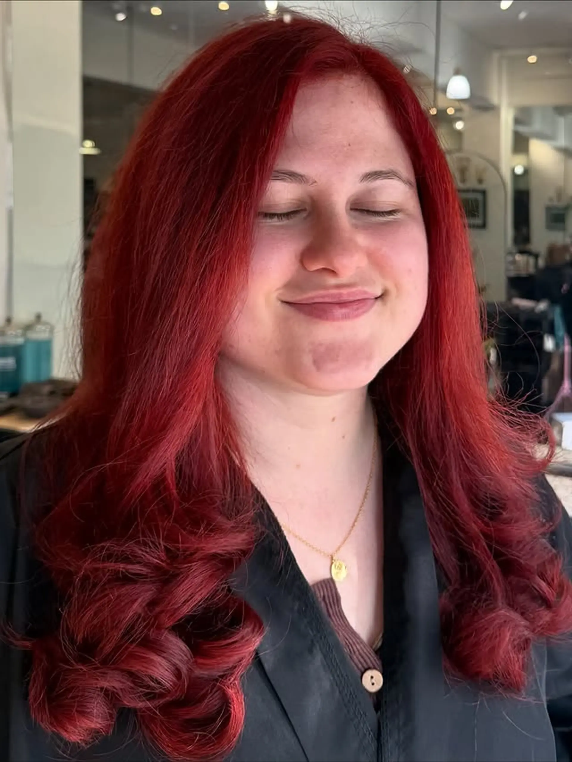 A long, layered hairstyle with romantic waves, colored in a vibrant red. 1