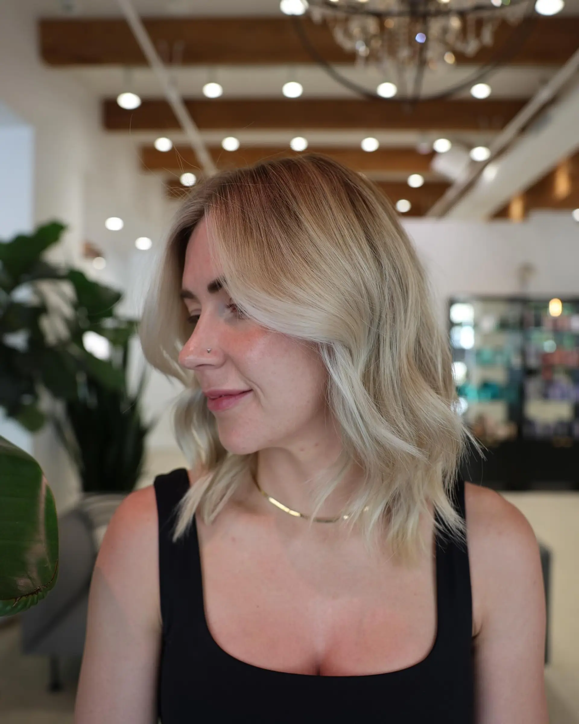 A trendy medium-length bronde lob with soft beach waves. 1