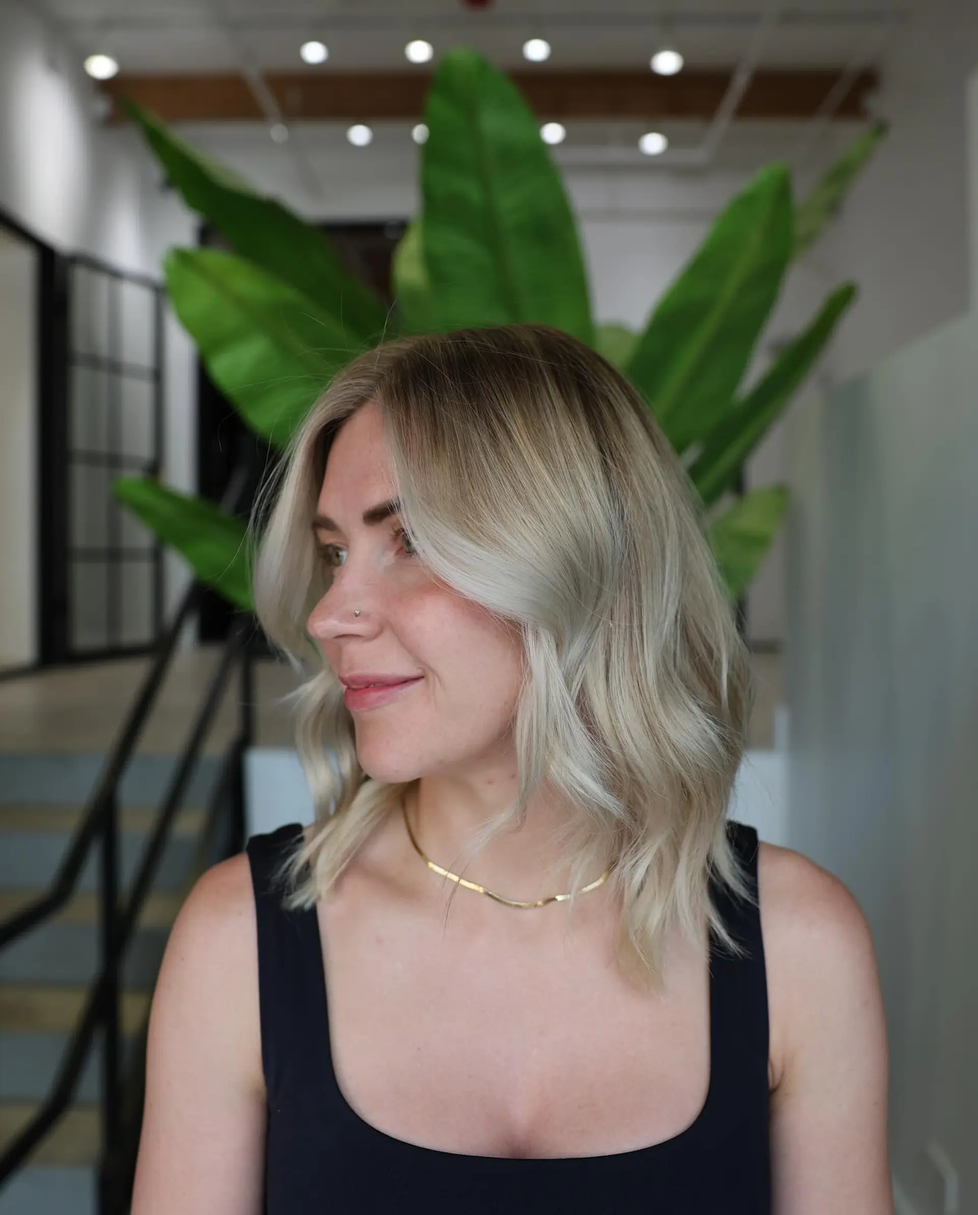 A trendy medium-length bronde lob with soft beach waves. 2