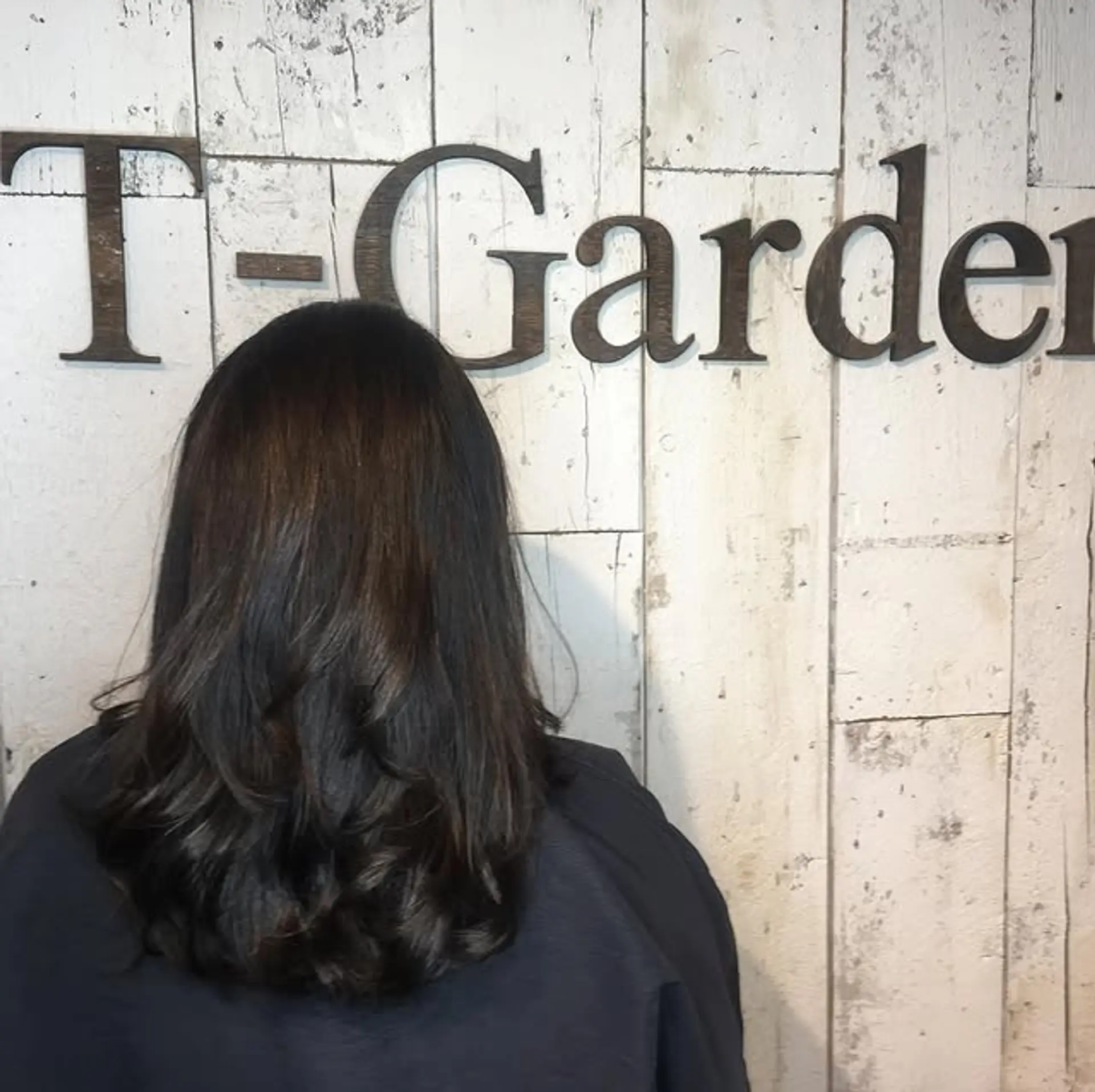 A stylish medium-length haircut with subtle waves and layers for volume. 1