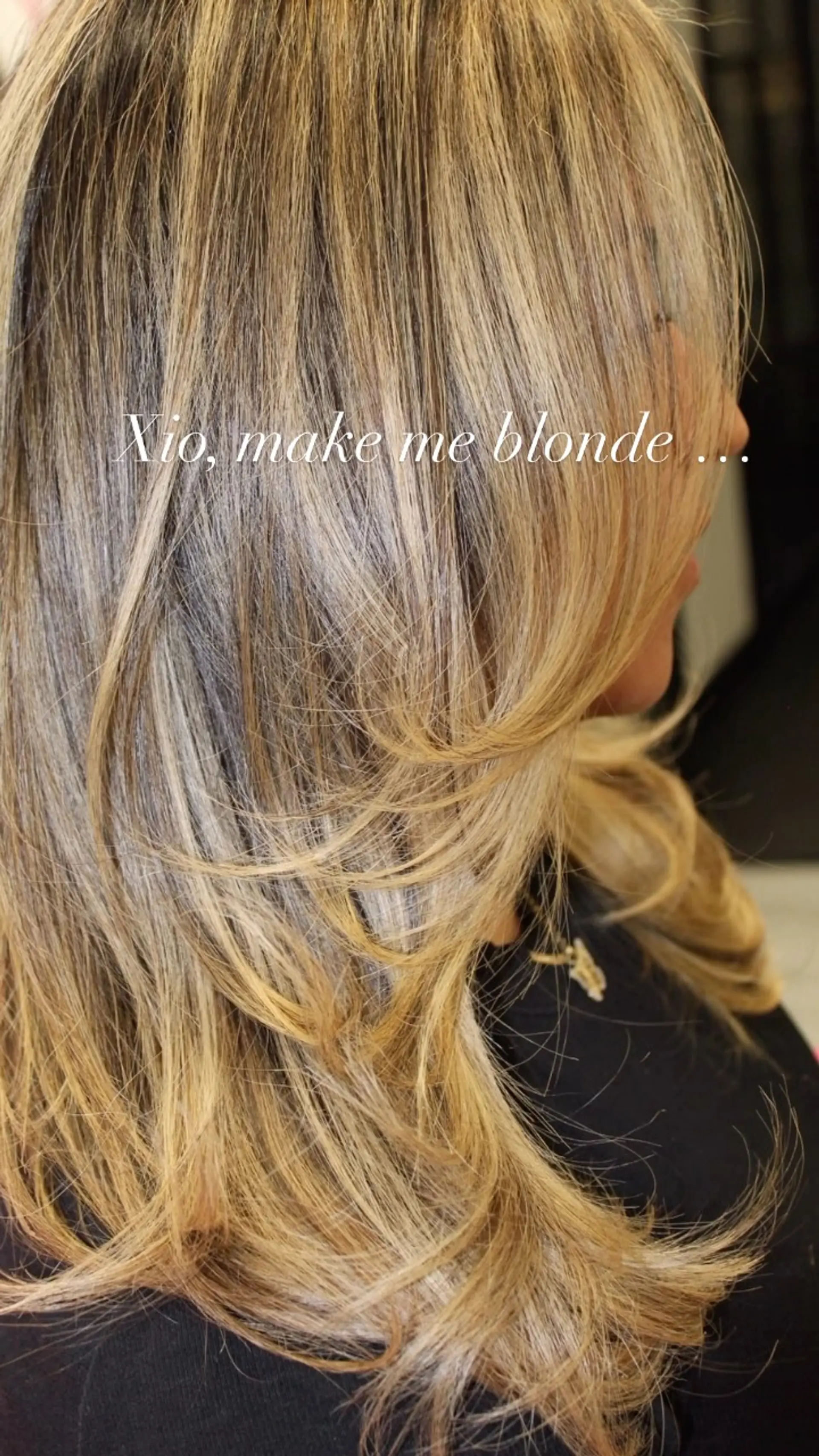 Long multi-dimensional blonde hair cut with flowing layers and styled in a bouncy, swept blowout with softly flipped ends. 1